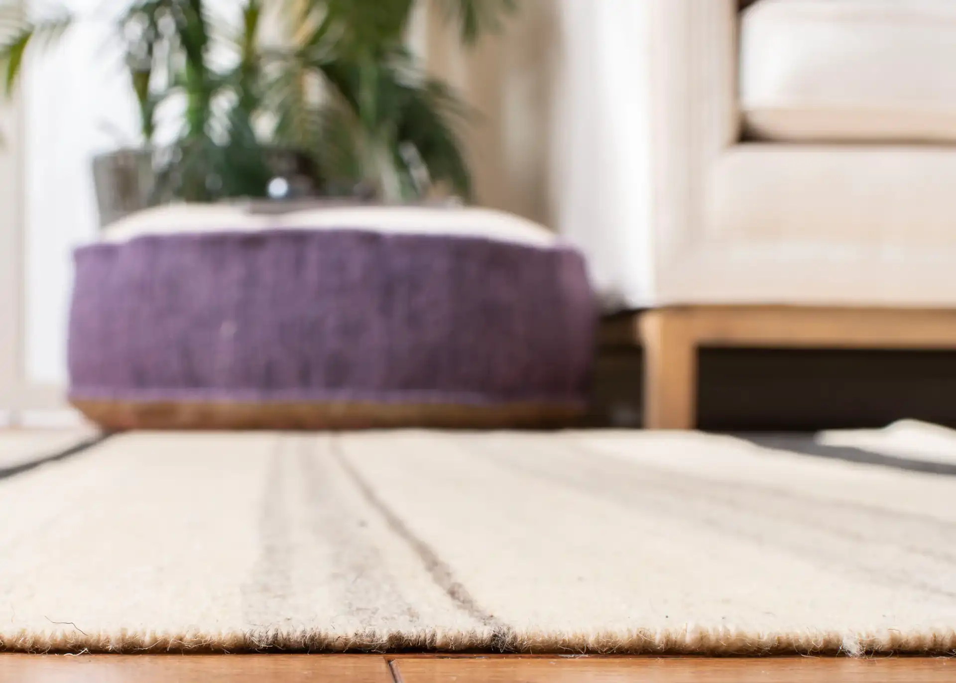 Dhurries Modern Banded Stripe Hand-Woven Wool Rug in Natural / Gray in a styled room