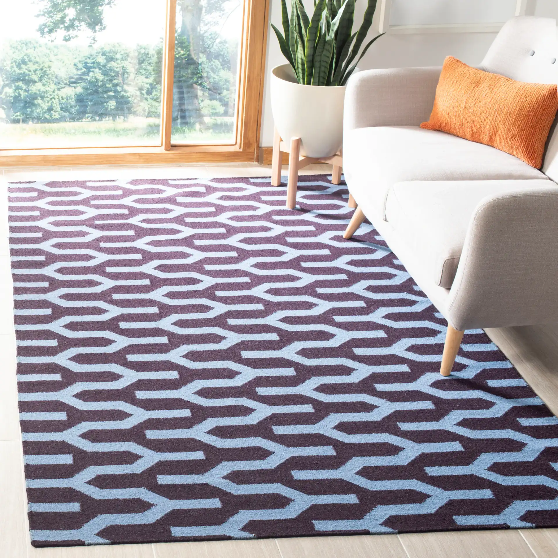 Dhurries Interlocking Chevron Hand-Woven Wool Rug in Purple / Blue in a styled room