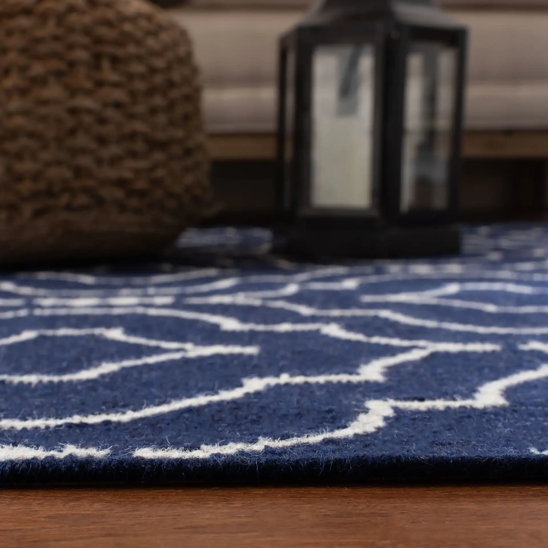 Dhurries Nested Trellis Hand-Woven Wool Rug in Navy / Ivory in a styled room