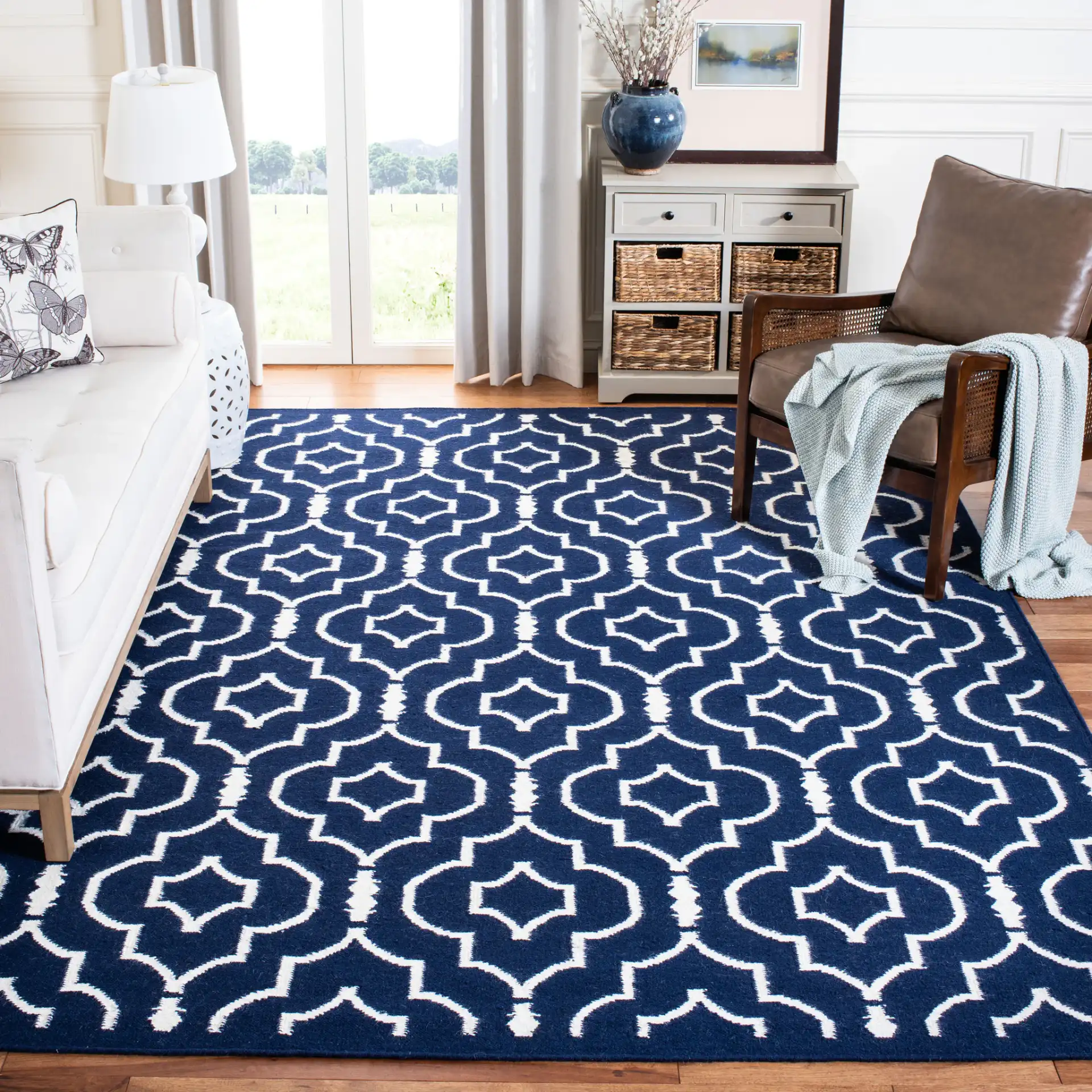 Dhurries Nested Trellis Hand-Woven Wool Rug in Navy / Ivory in a styled room