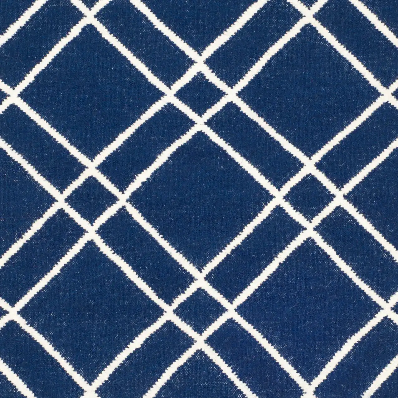 Dhurries Double Diamond Hand-Woven Wool Rug in Navy / Ivory in a styled room