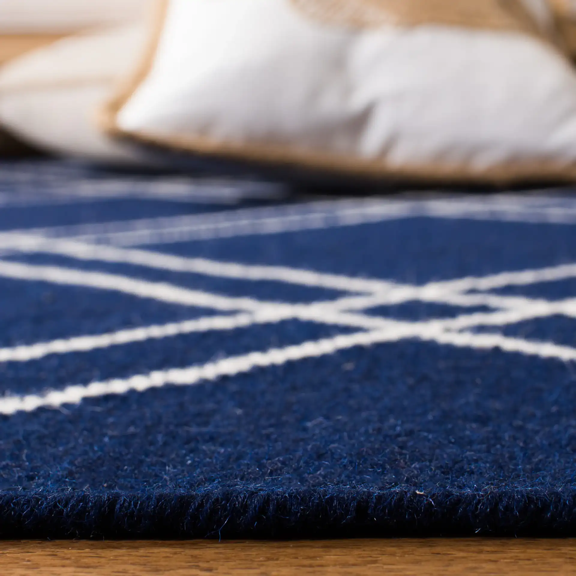 Dhurries Double Diamond Hand-Woven Wool Rug in Navy / Ivory in a styled room