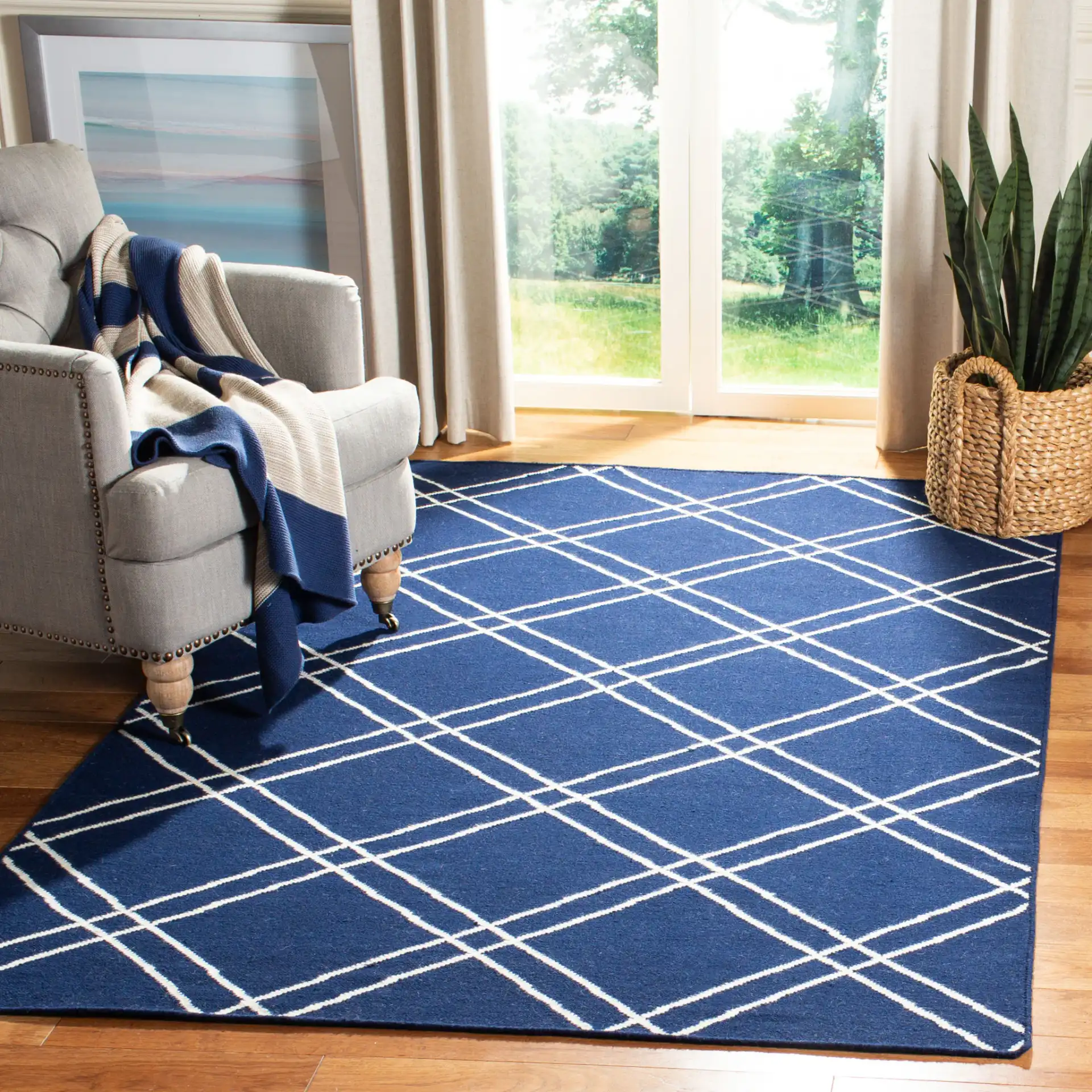 Dhurries Double Diamond Hand-Woven Wool Rug in Navy / Ivory in a styled room