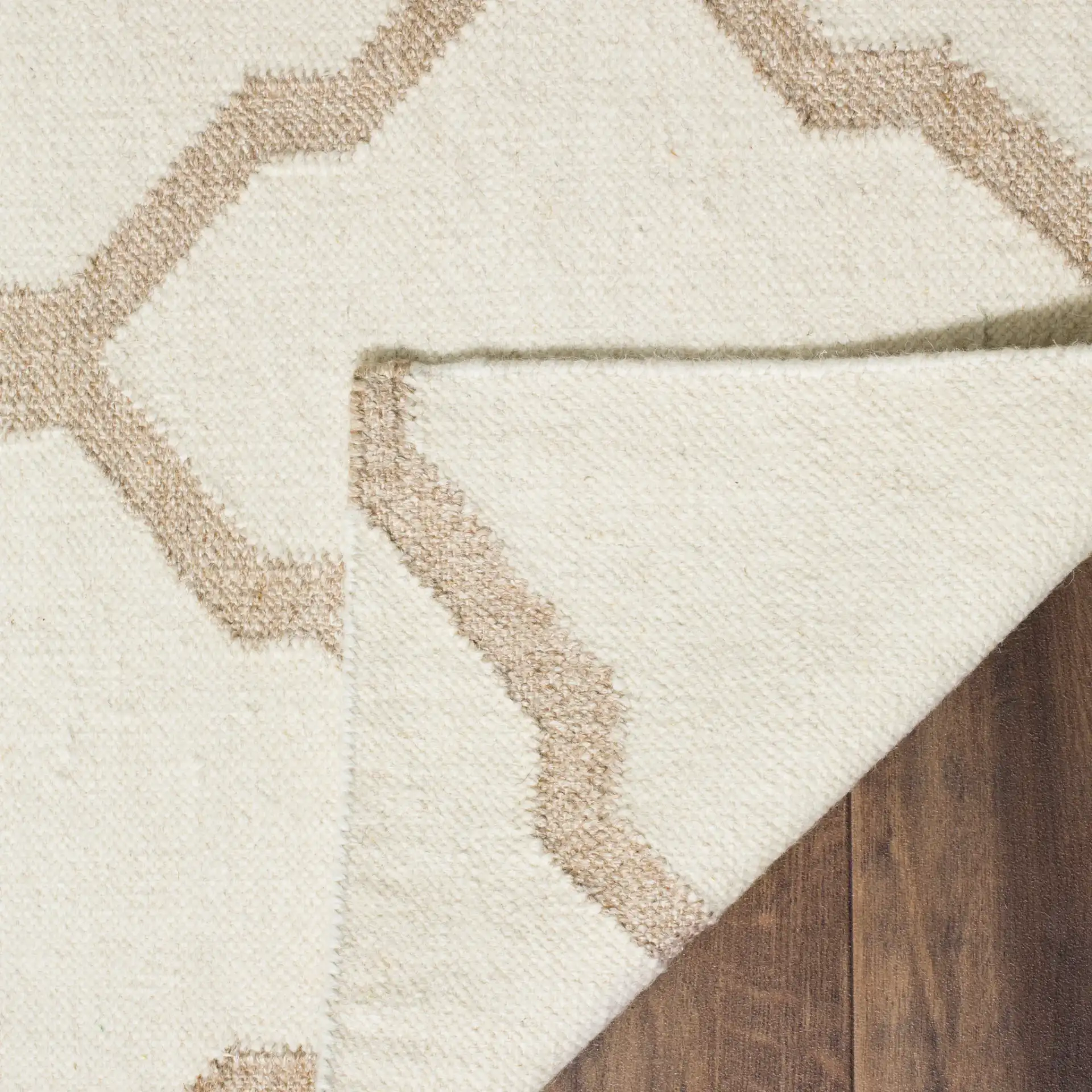 Dhurries Large-Scale Trellis Hand-Woven Rug in Ivory / Camel in a styled room