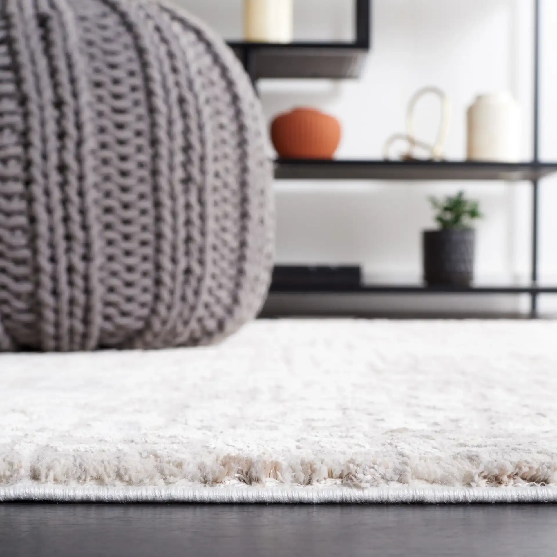 Diamond Distressed Grid Rug in Beige / Gray in a styled room