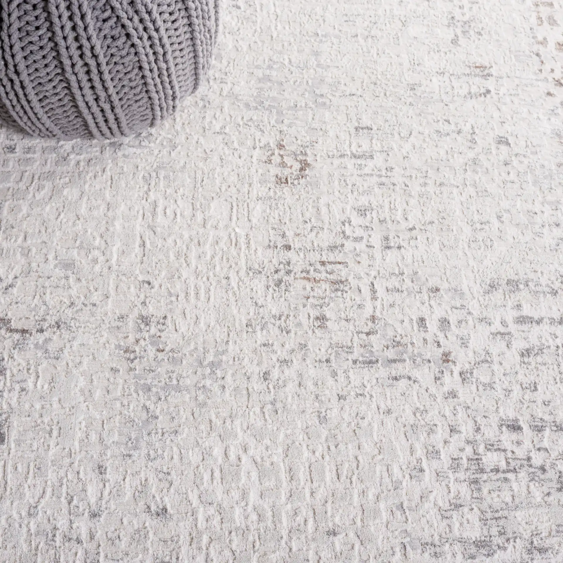 Diamond Distressed Grid Rug in Beige / Gray in a styled room