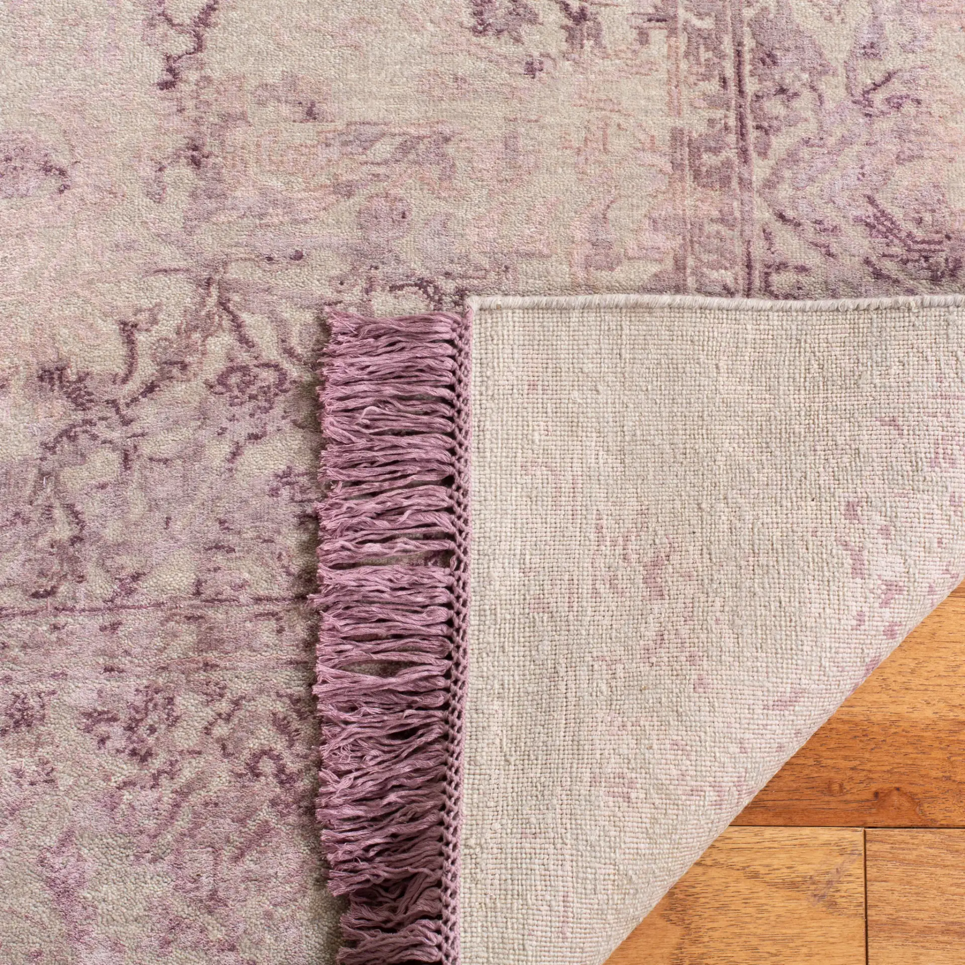 Dream Distressed Botanical Border Hand-Knotted Rug in Dream Distressed Botanical Border Hand-Knotted Rug in a styled room