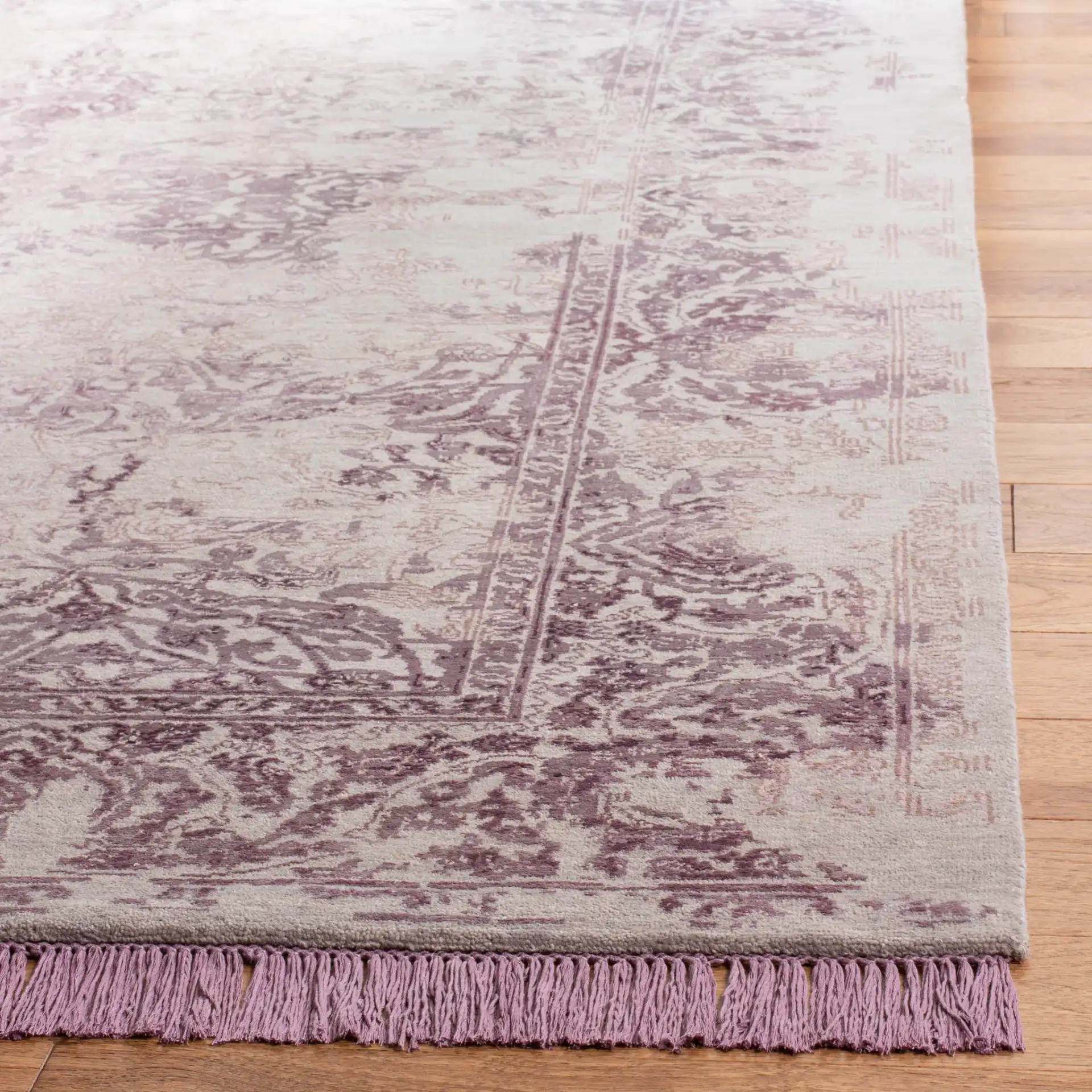 Dream Distressed Botanical Border Hand-Knotted Rug in Dream Distressed Botanical Border Hand-Knotted Rug in a styled room