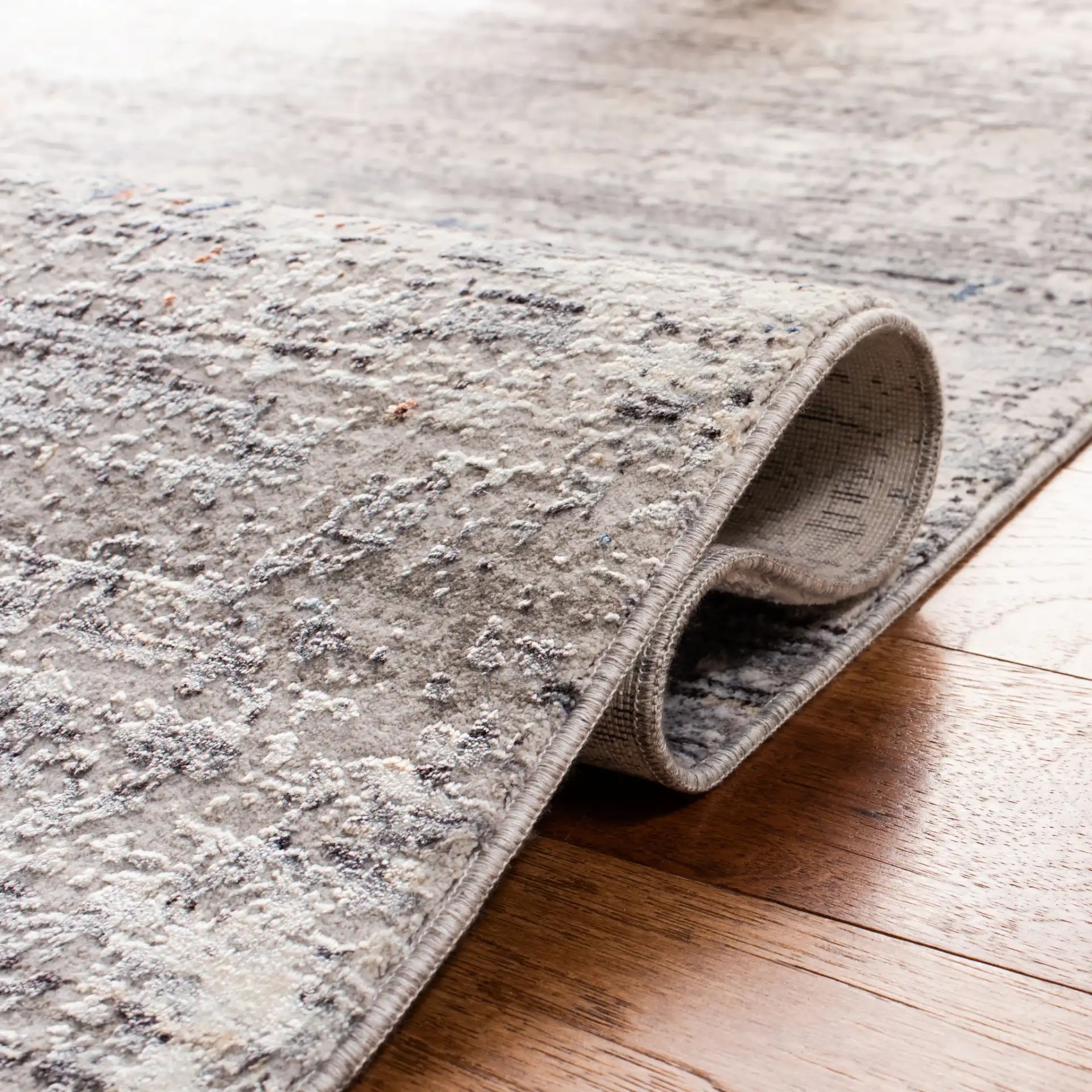 Dream Abstract Stripe Rug in Gray / Blue in a styled room