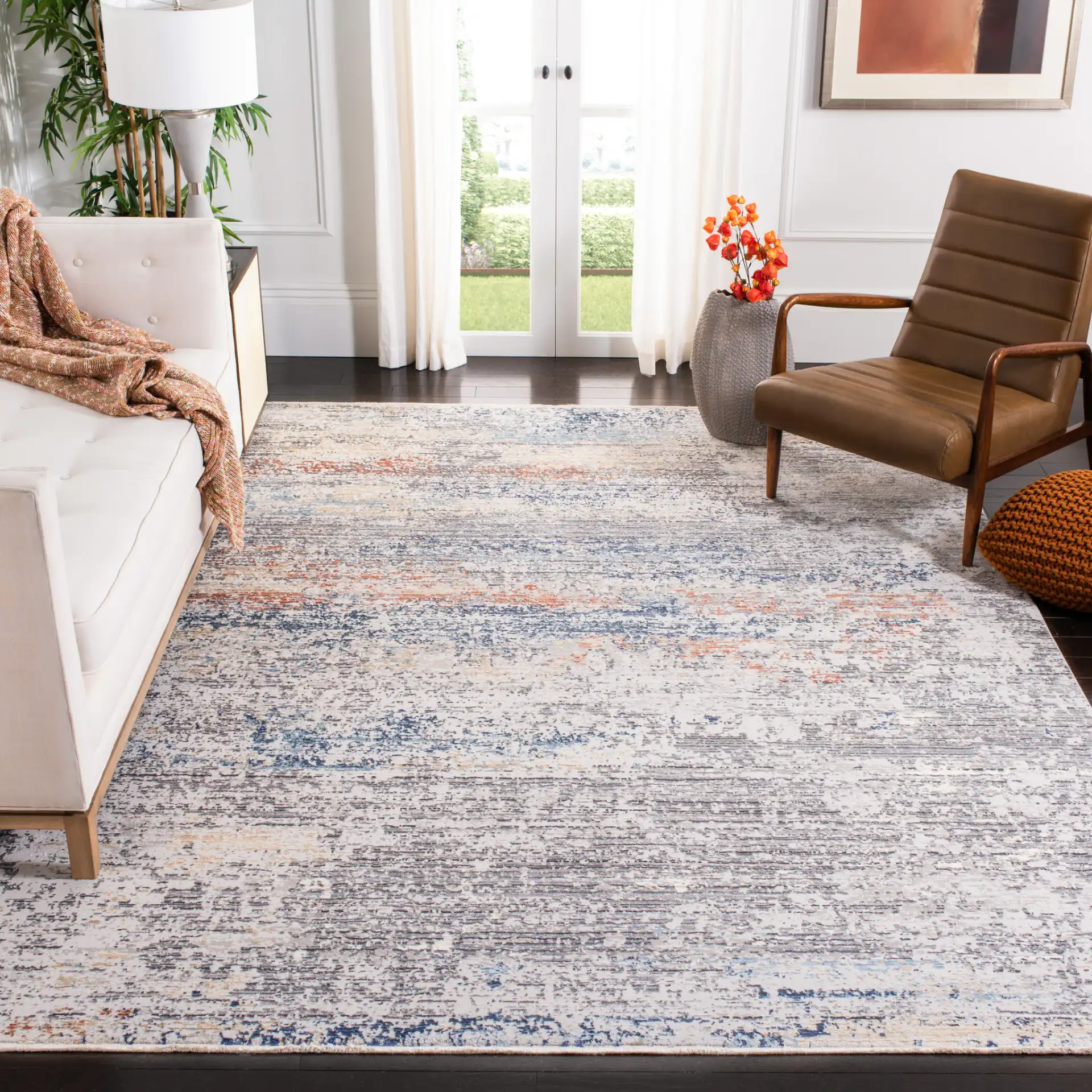 Dream Abstract Stripe Rug in Gray / Blue in a styled room