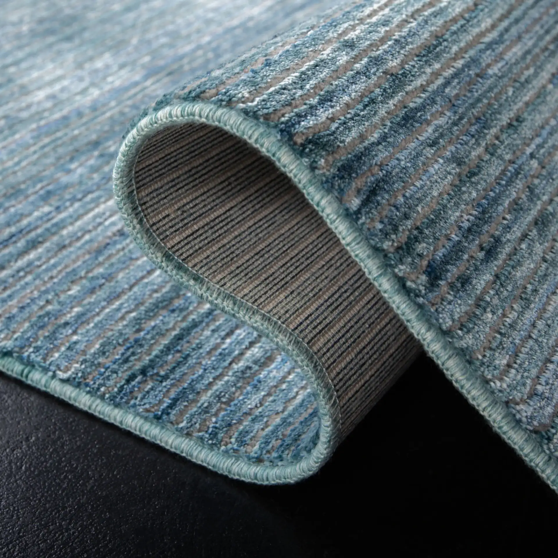 Dream Linear Stripe Rug in Blue / Gray in a styled room