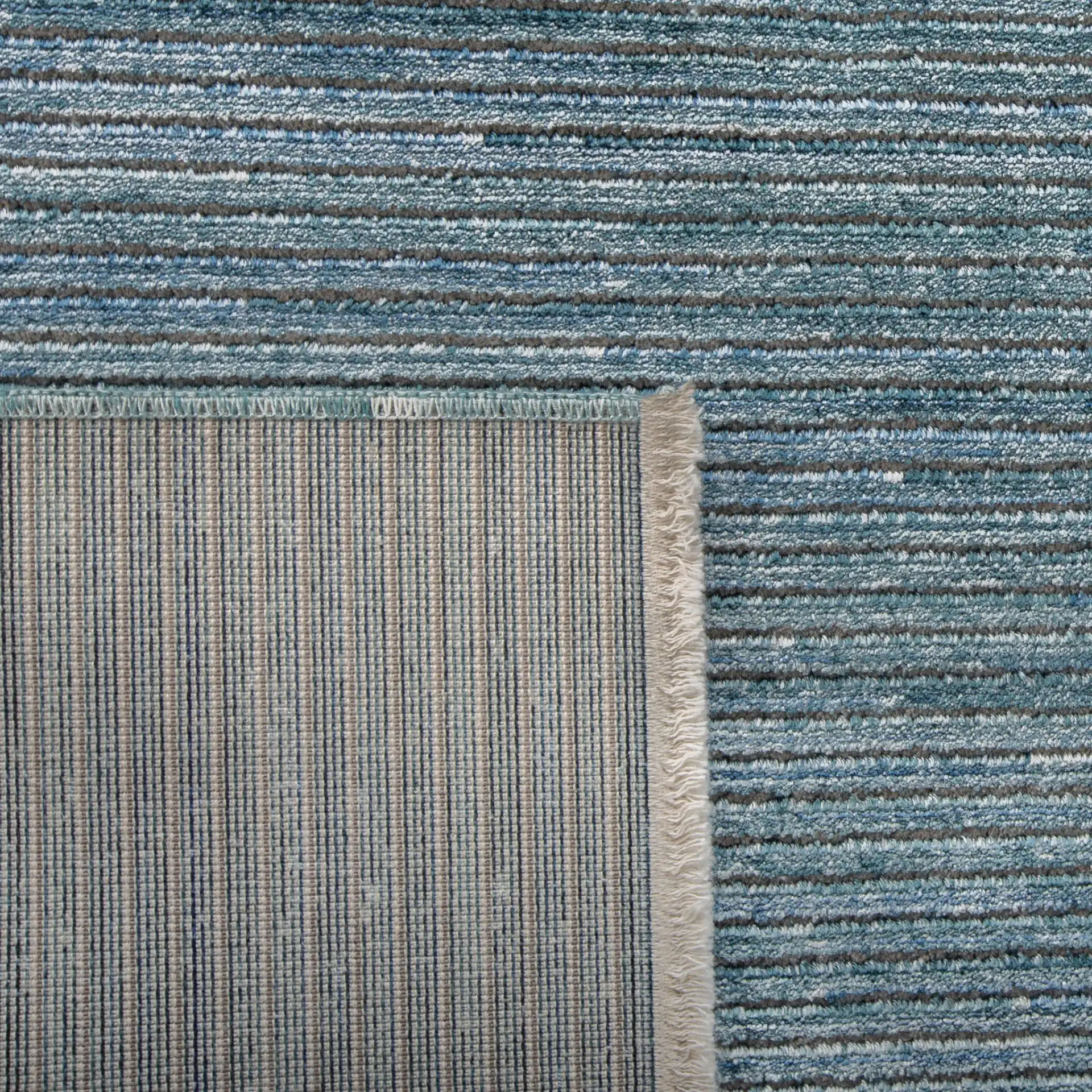 Dream Linear Stripe Rug in Blue / Gray in a styled room
