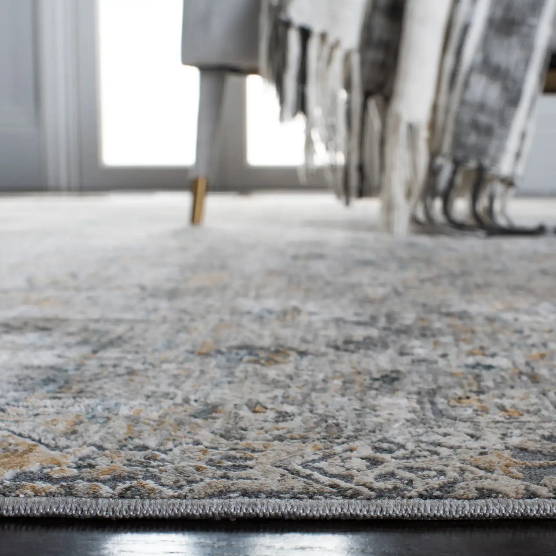 Dream Distressed Geometric Rug in Gray / Gold in a styled room