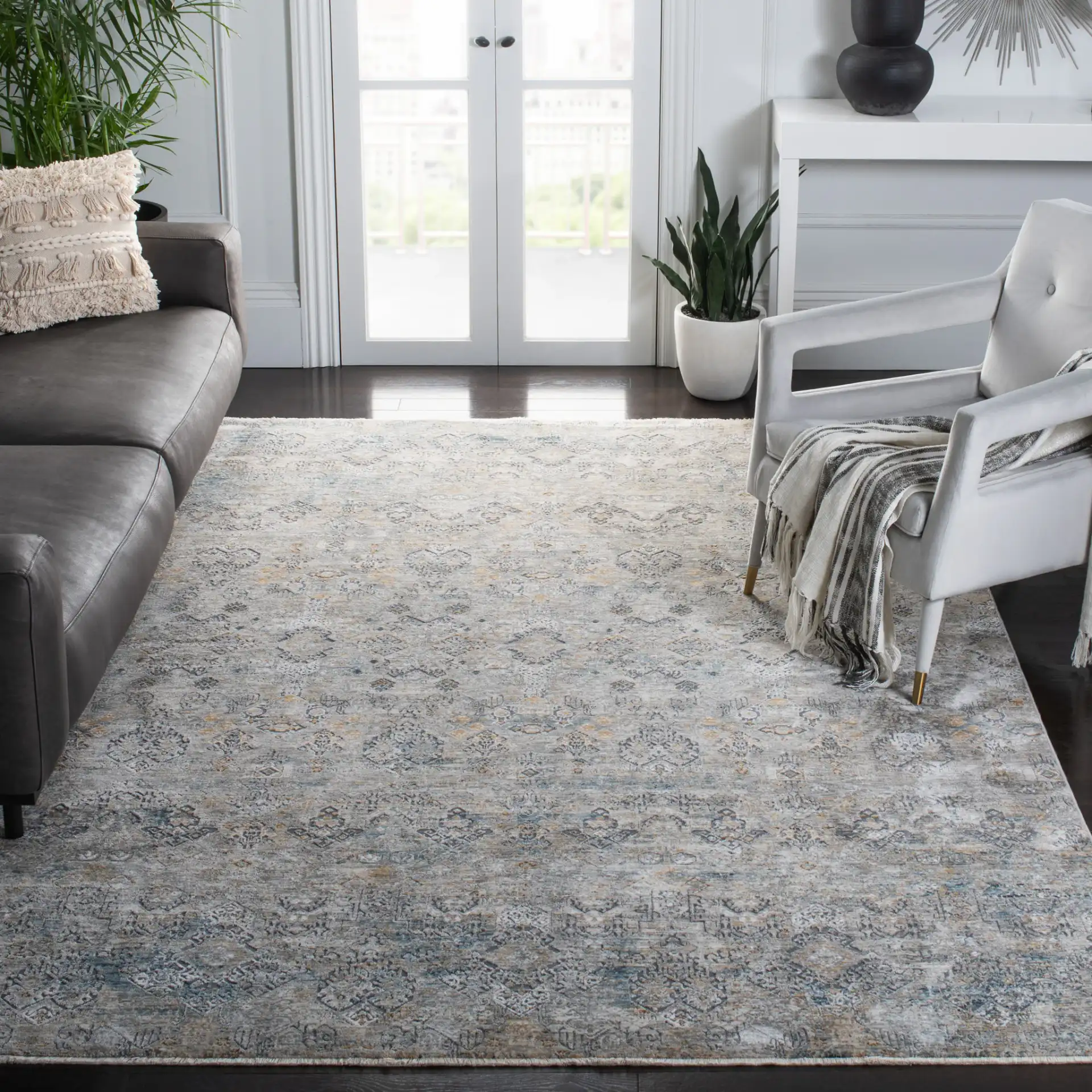 Dream Distressed Geometric Rug in Gray / Gold in a styled room