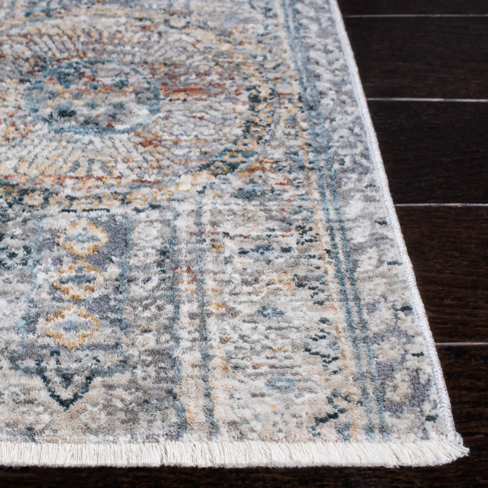 Dream Paneled Medallion Rug in Gray / Gold in a styled room
