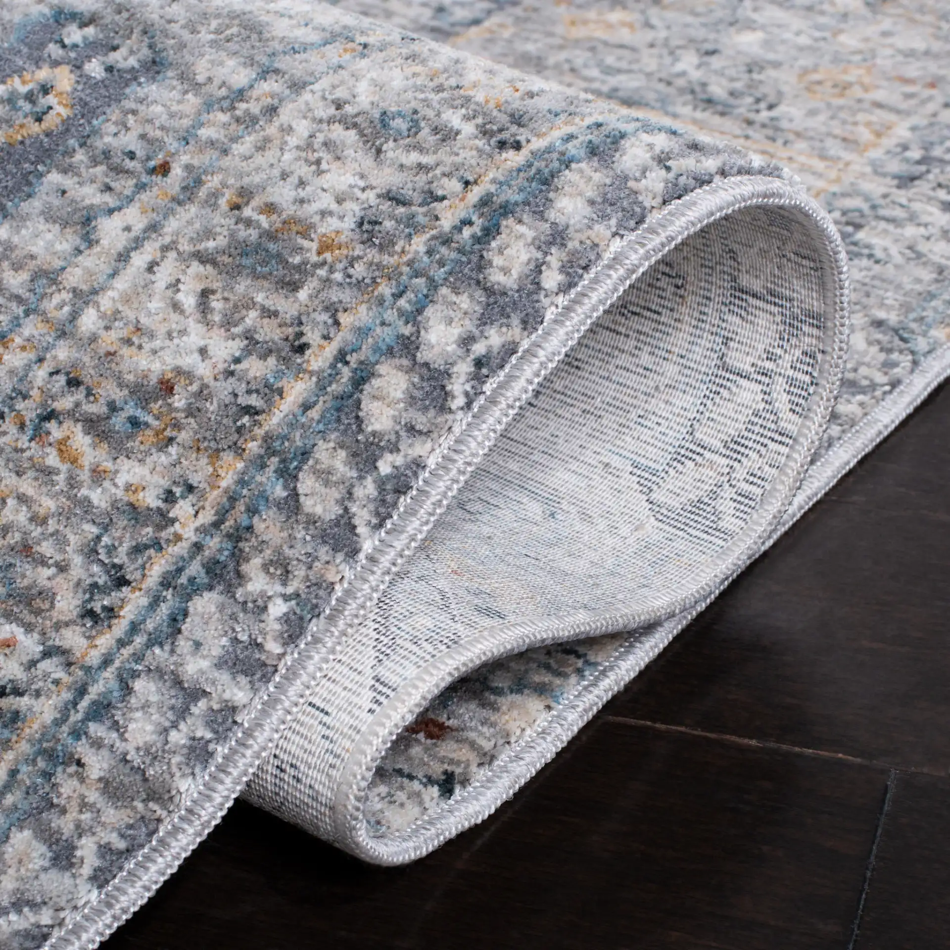 Dream Paneled Medallion Rug in Gray / Gold in a styled room
