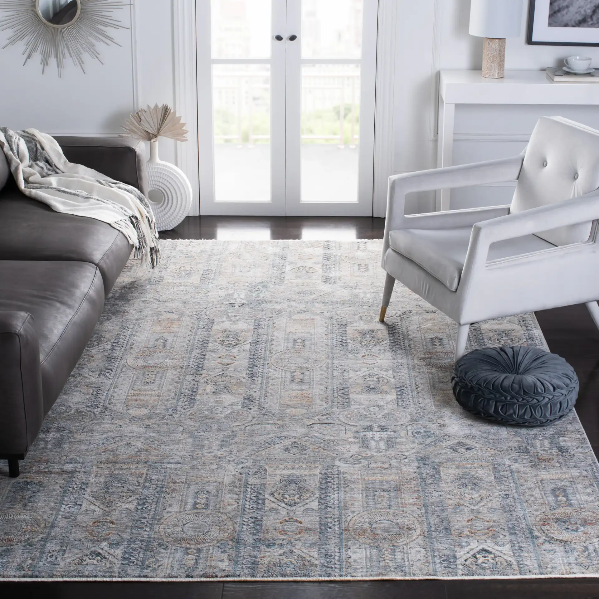 Dream Paneled Medallion Rug in Gray / Gold in a styled room