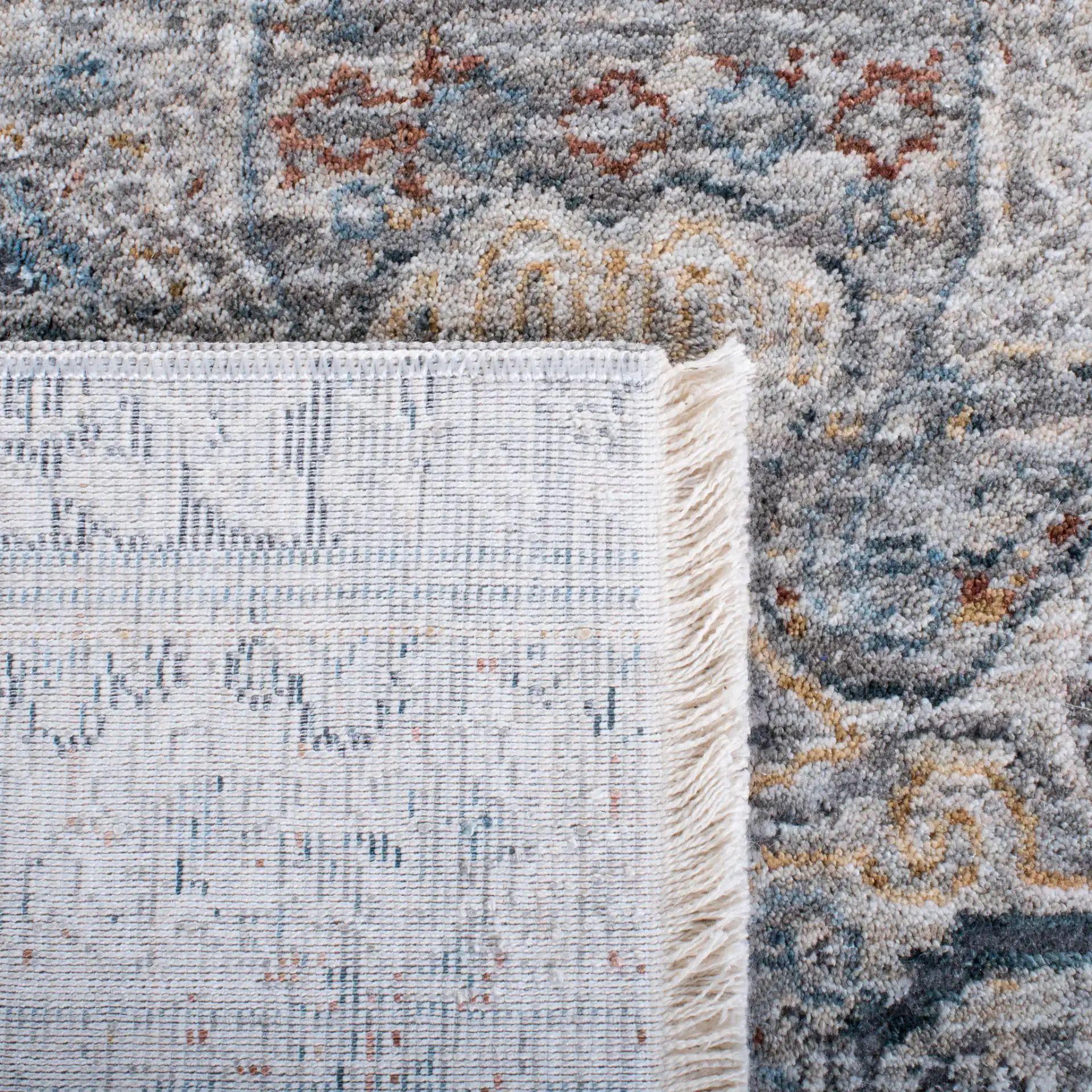 Dream Paneled Medallion Rug in Gray / Gold in a styled room