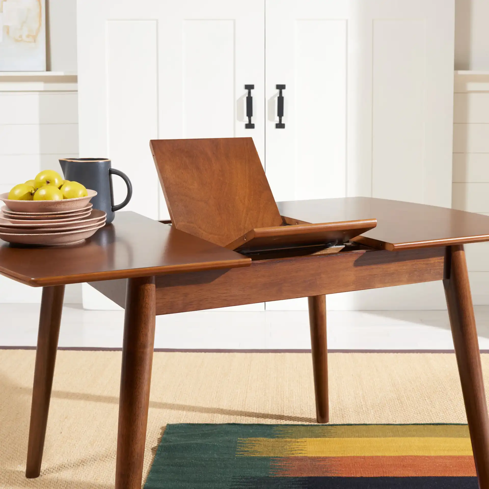 Varda Manual Extension Dining Table in Walnut in a styled room