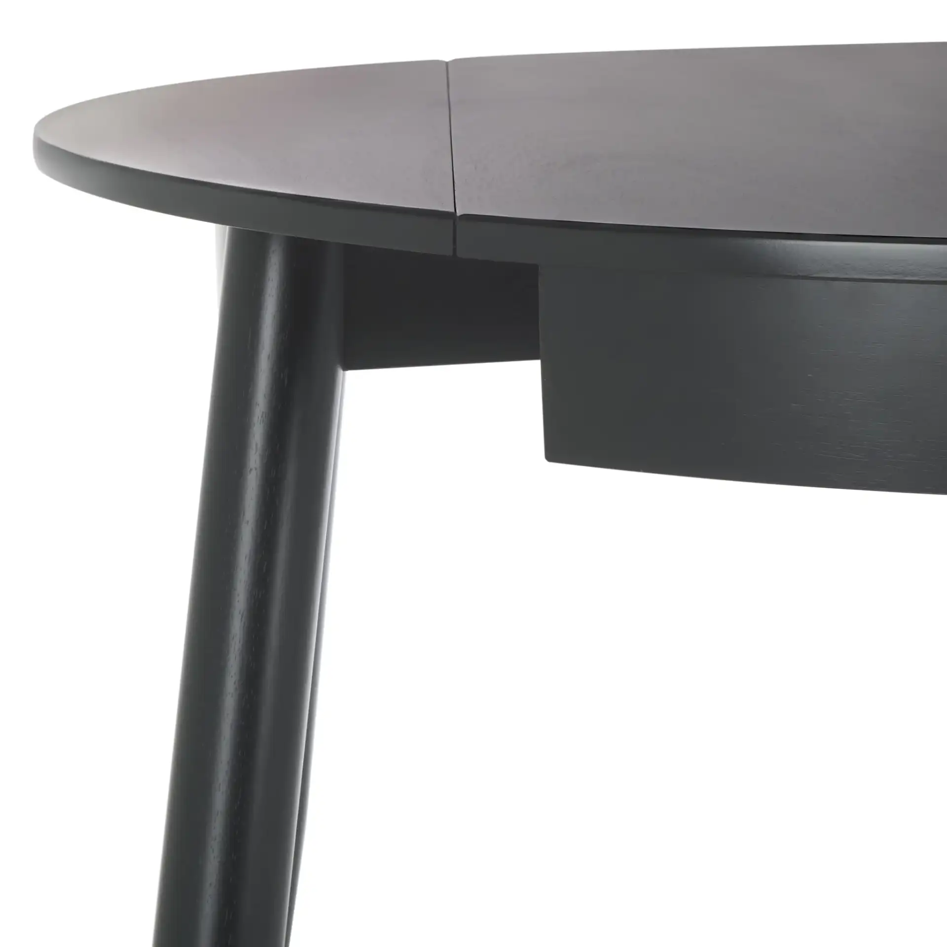 Malakai Folding Round Dining Table in Black in a styled room
