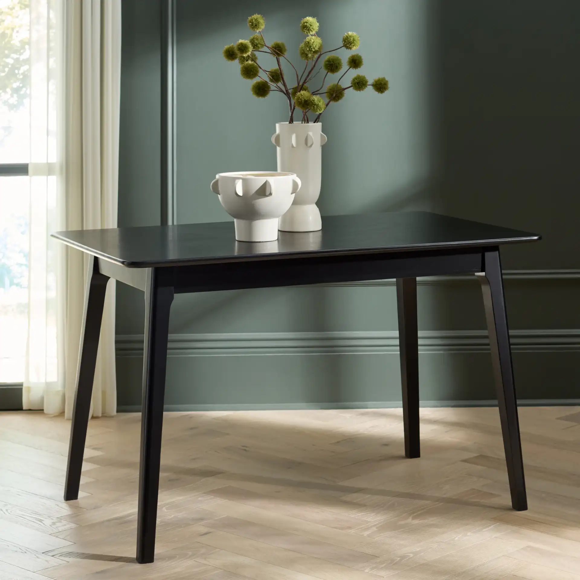 Forus Dining Table in Black in a styled room