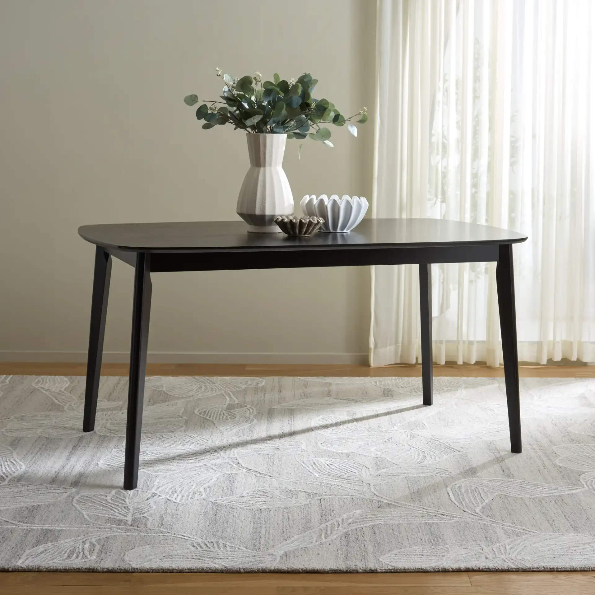 Bolinas Dining Table in Black in a styled room