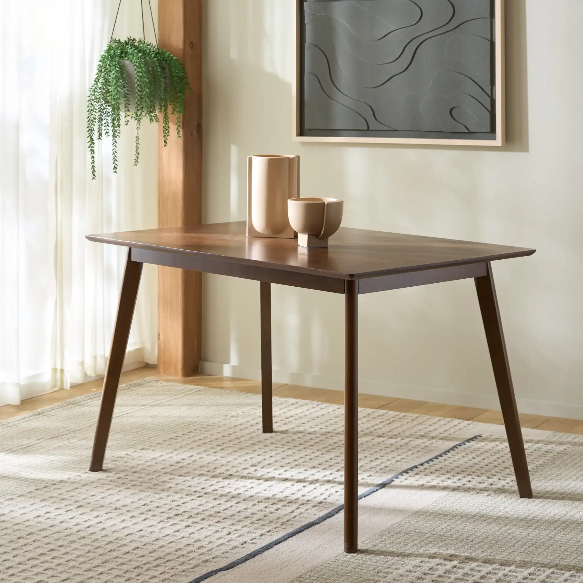 Amelin Dining Table in Walnut in a styled room