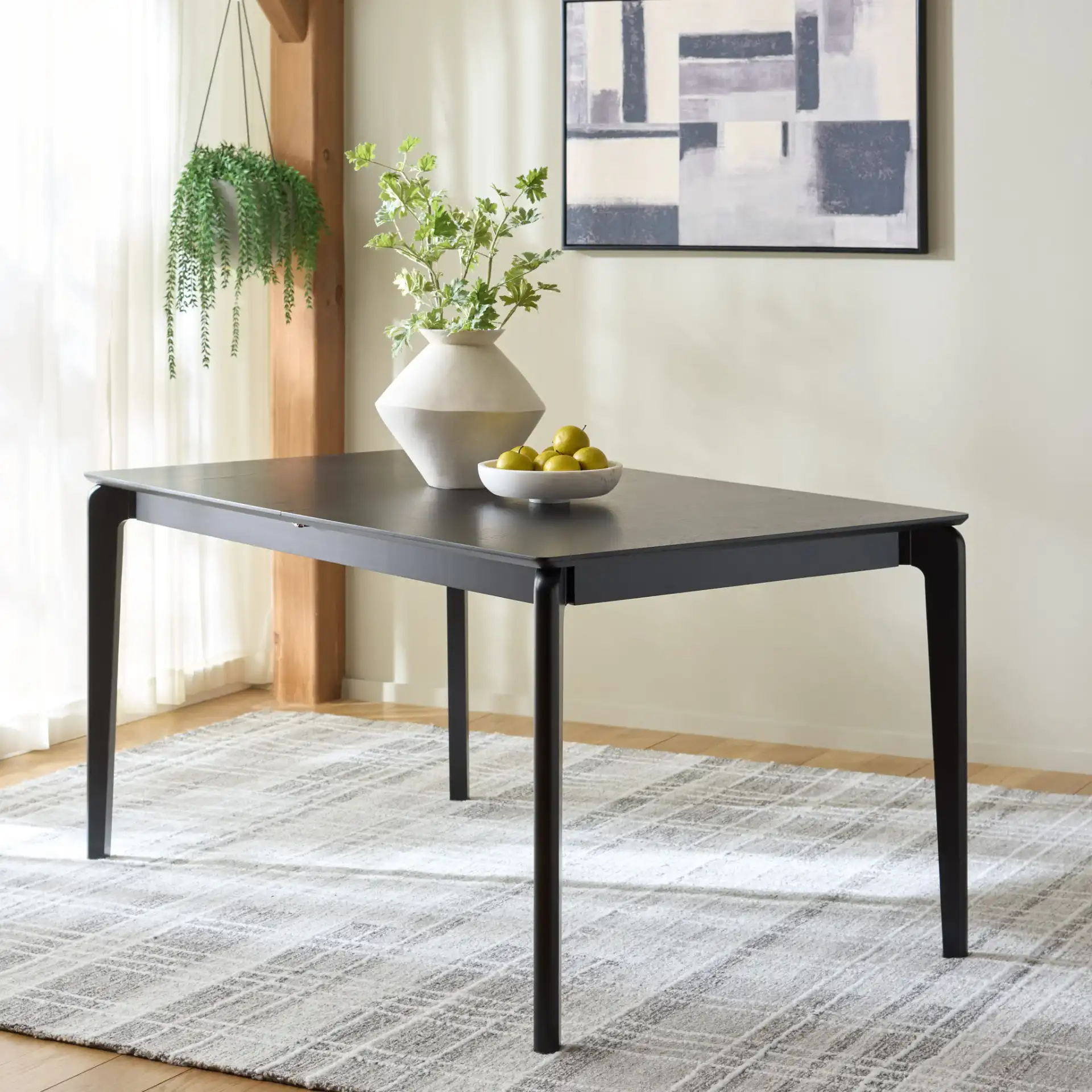 Hammis Extendable Dining Table in Black in a styled room