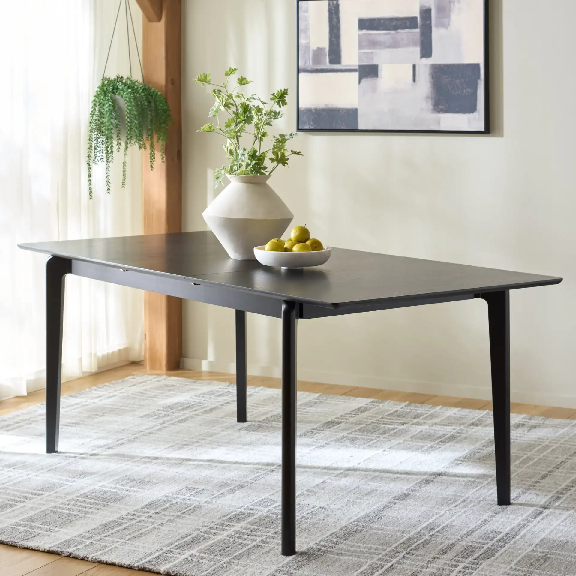 Hammis Extendable Dining Table in Black in a styled room