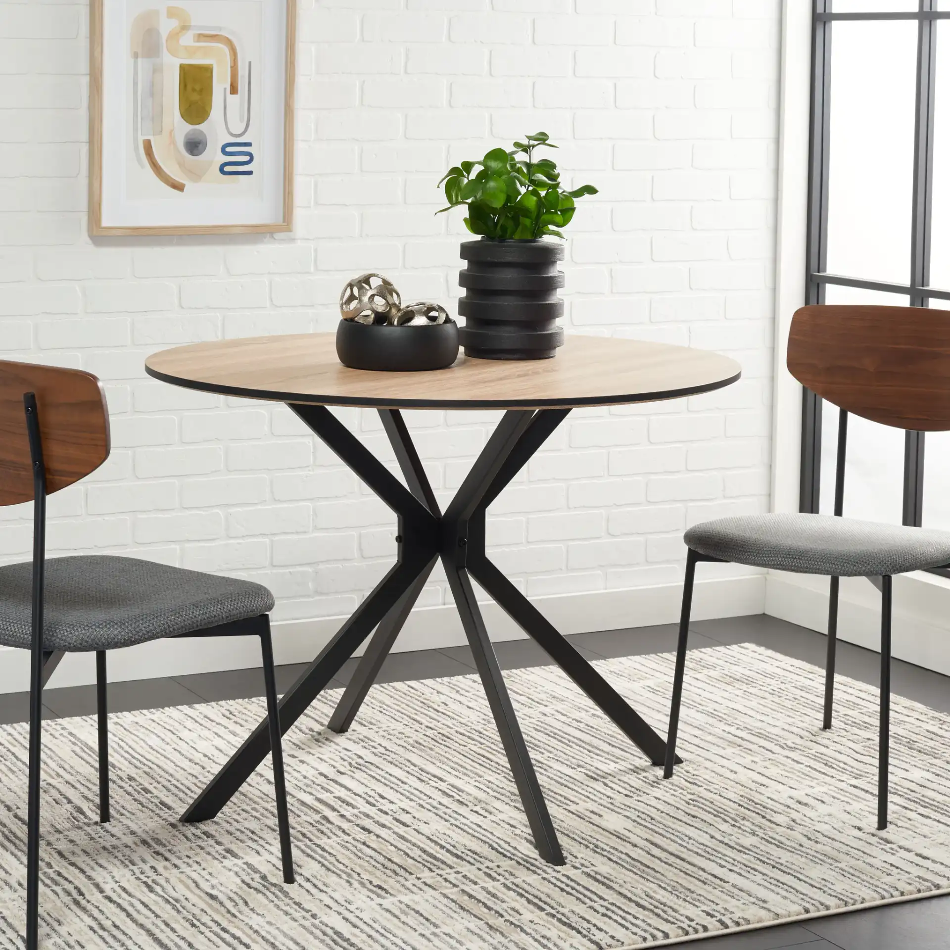 Rixley Dining Table in Natural / Black in a styled room
