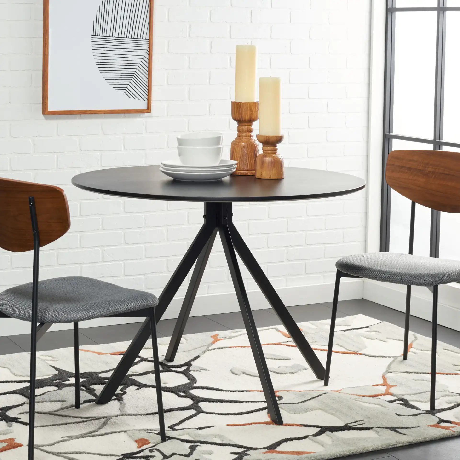 Skyden Dining Table in Black in a styled room