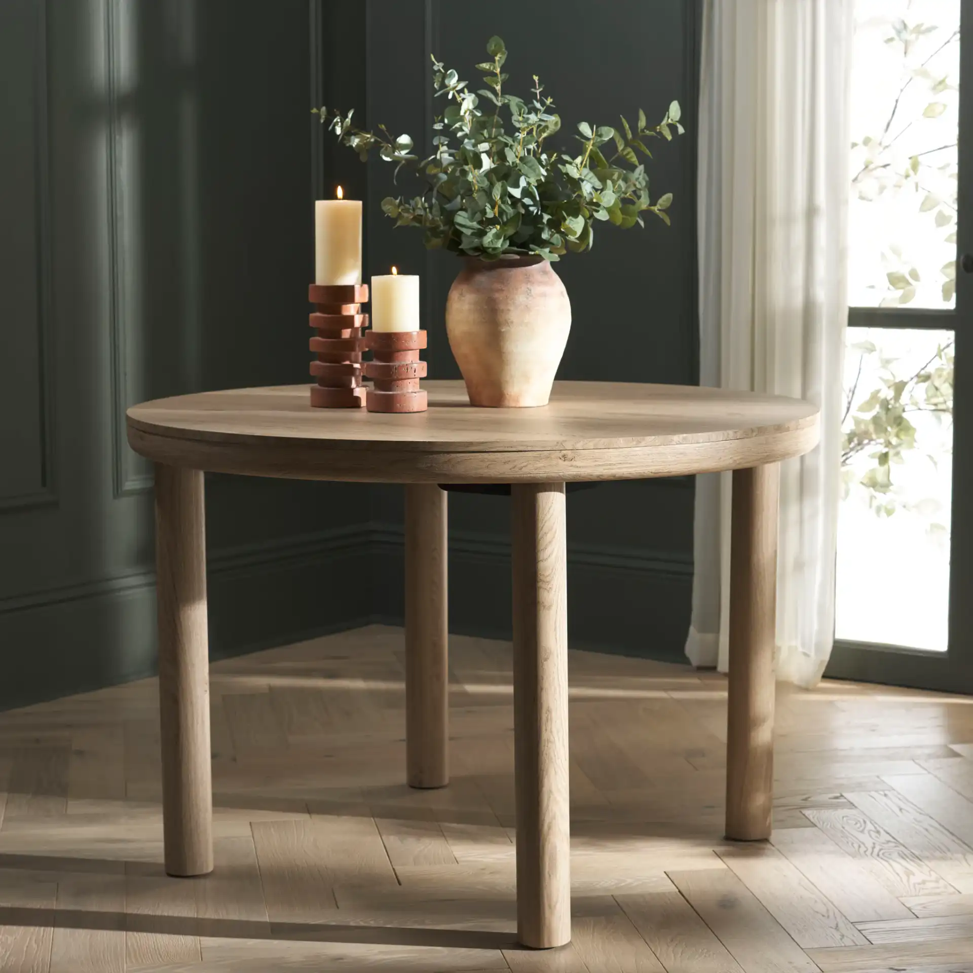 Detroitee Round Dining Table in Natural in a styled room