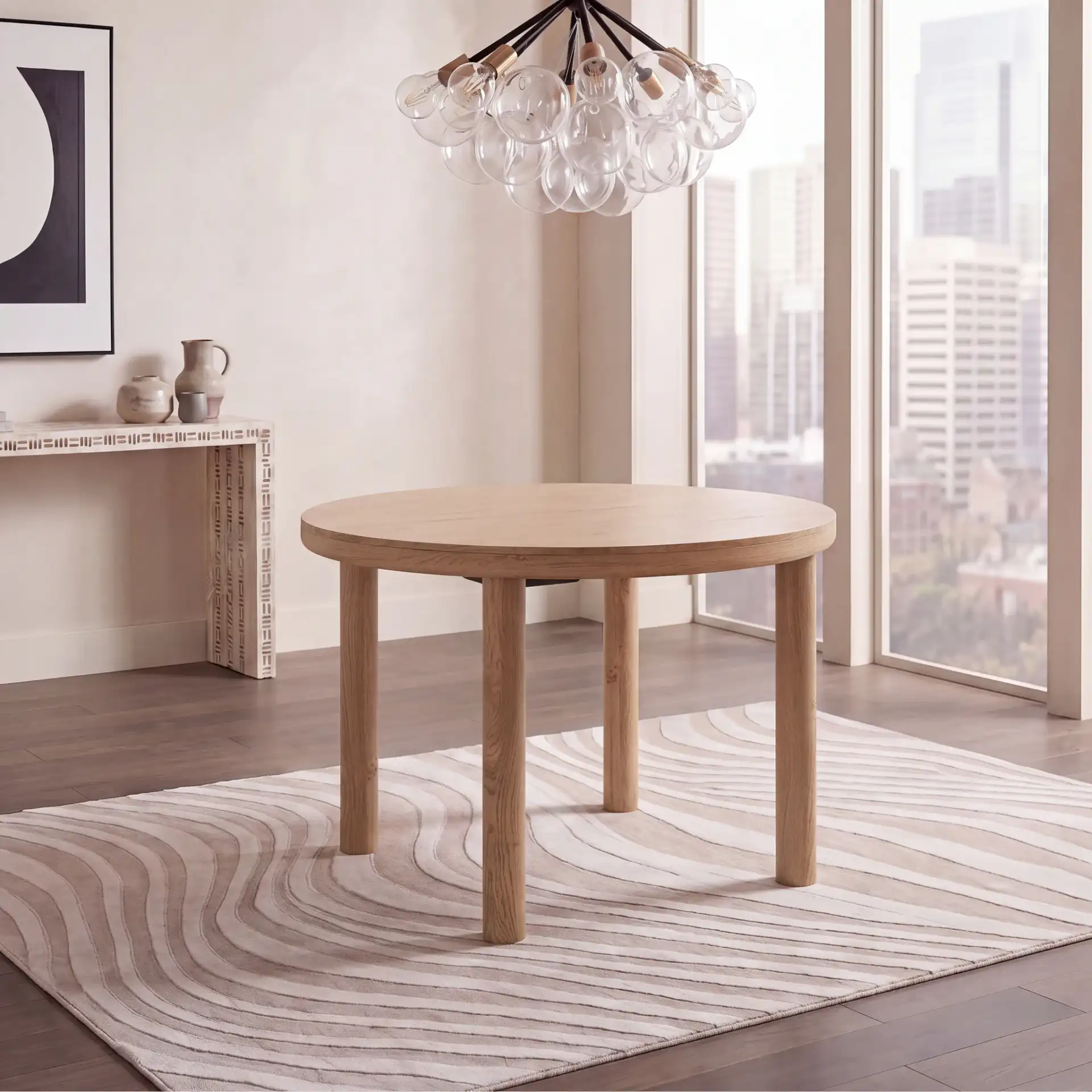 Detroitee Round Dining Table in Natural in a styled room