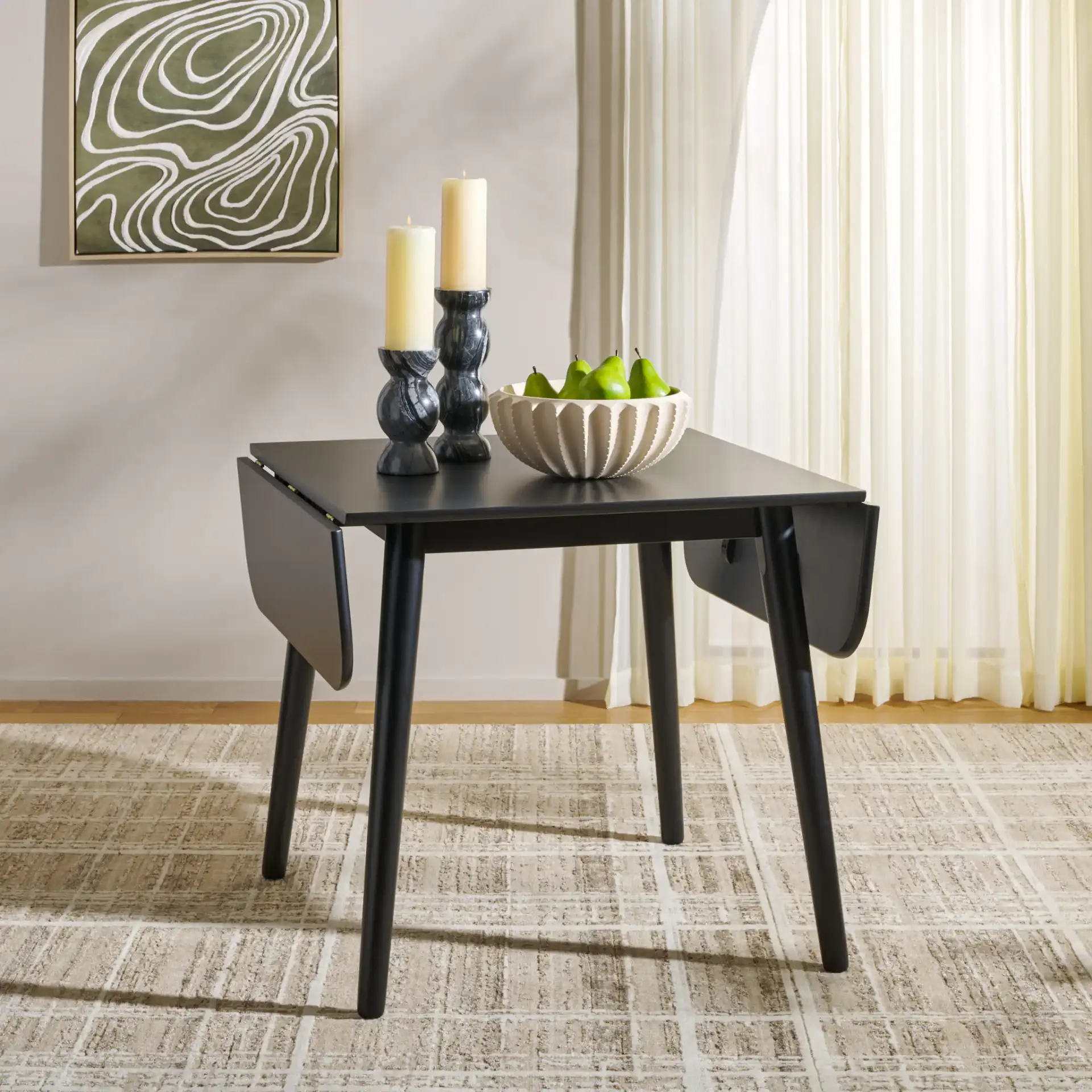 Damarius Drop Leaf Table in Matte Black in a styled room