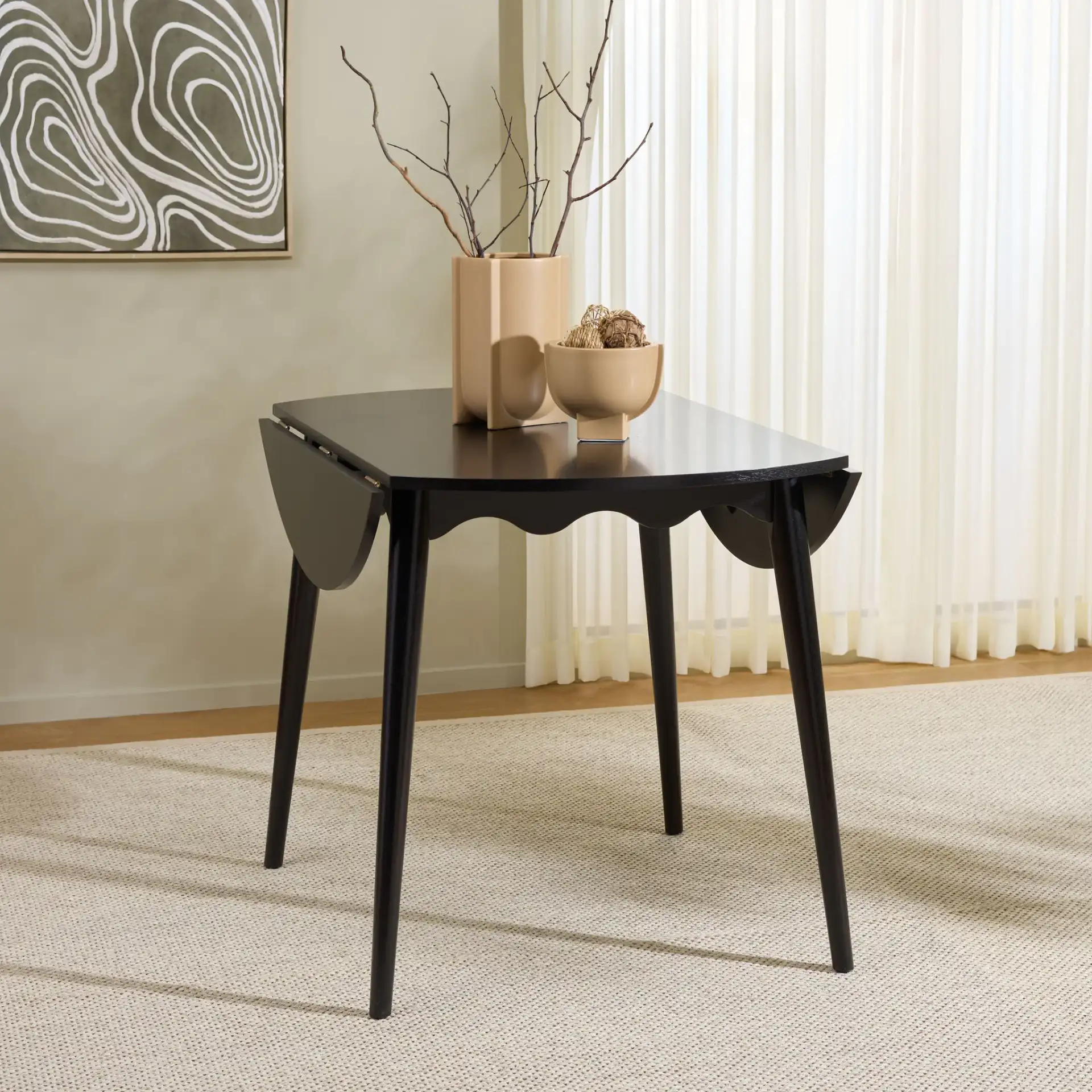 Roma Round Drop Leaf Scallop Table in Black in a styled room