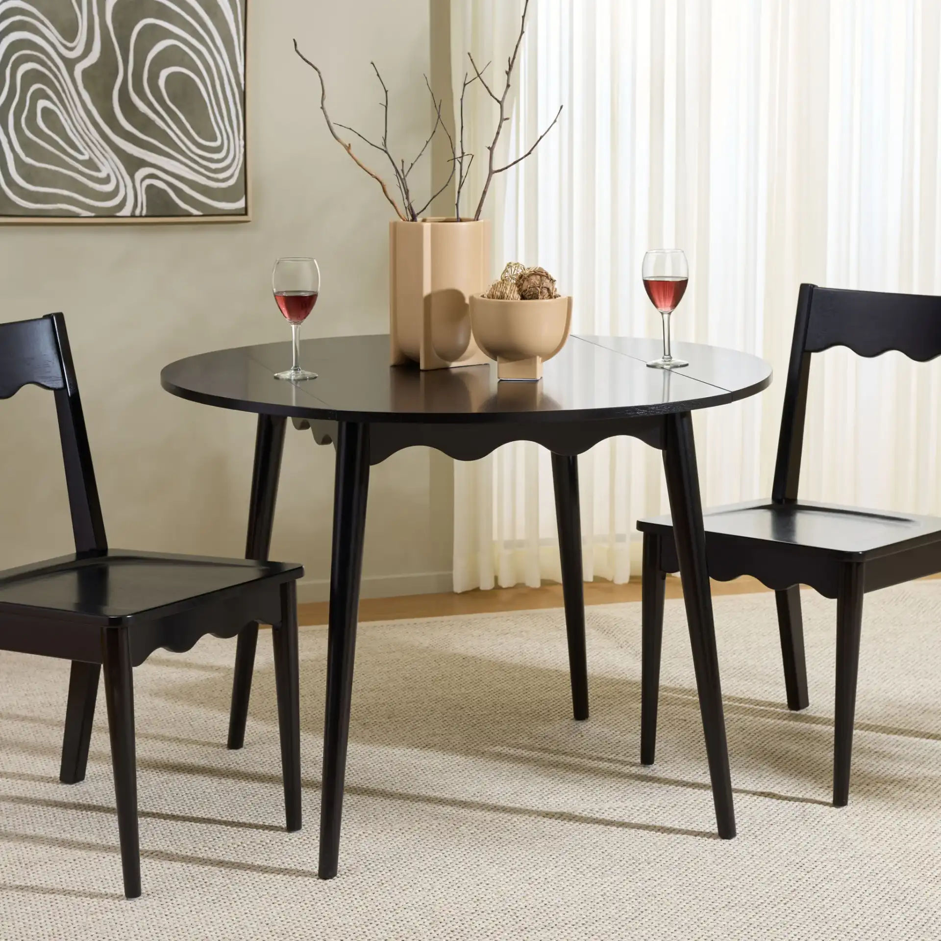 Roma Round Drop Leaf Scallop Table in Black in a styled room