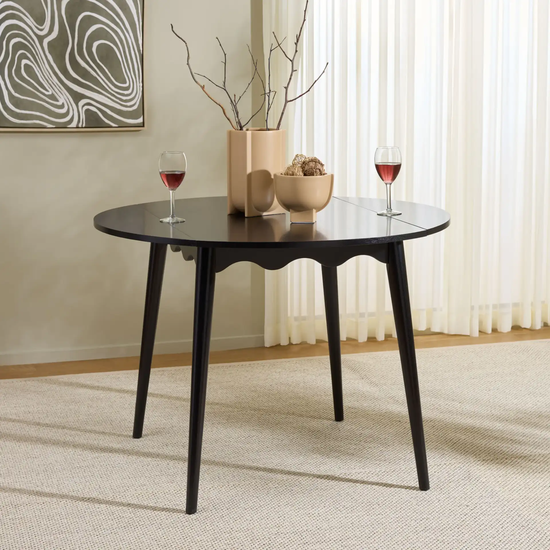 Roma Round Drop Leaf Scallop Table in Black in a styled room