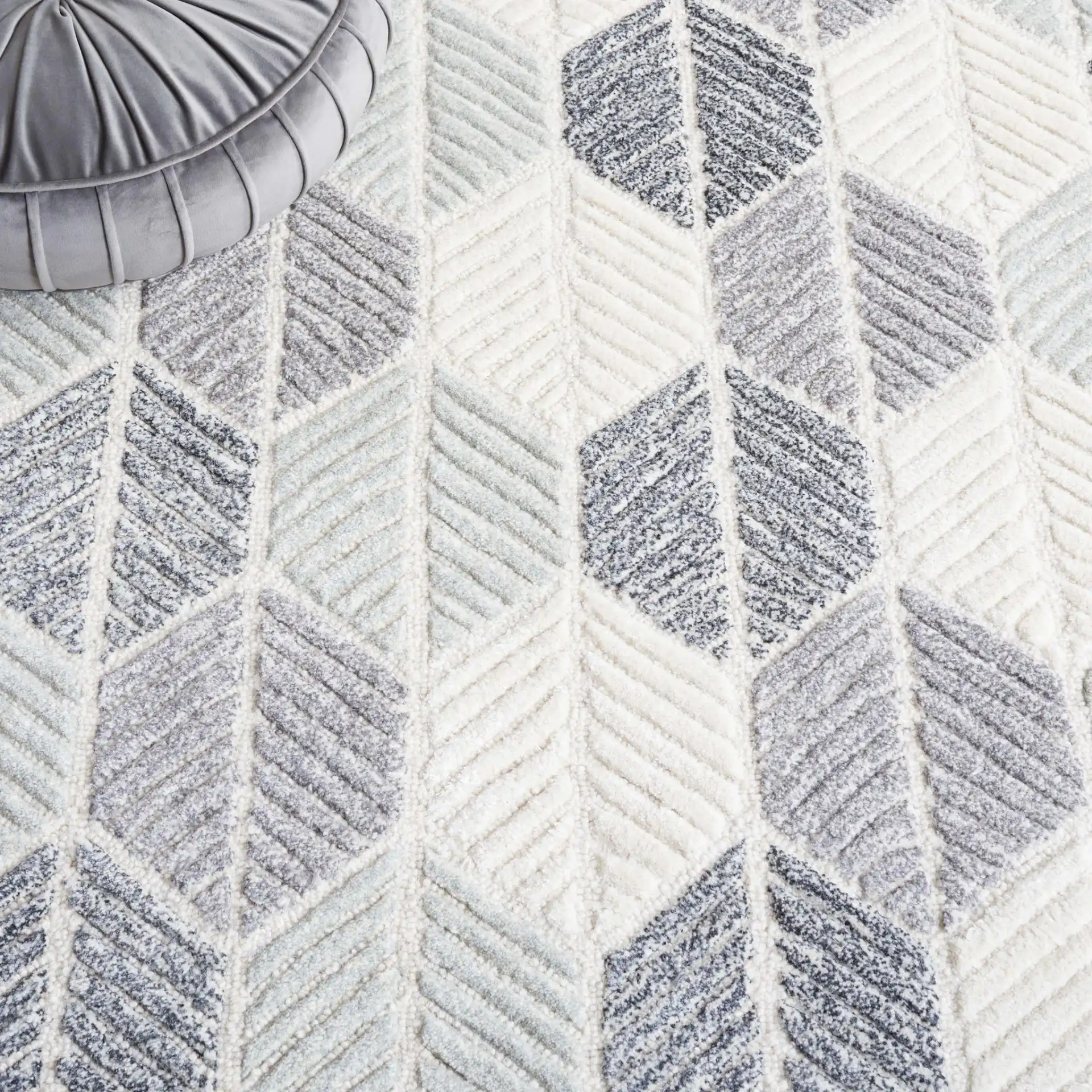 Ebony Leaf Hand-Tufted Rug in Gray / Ivory in a styled room