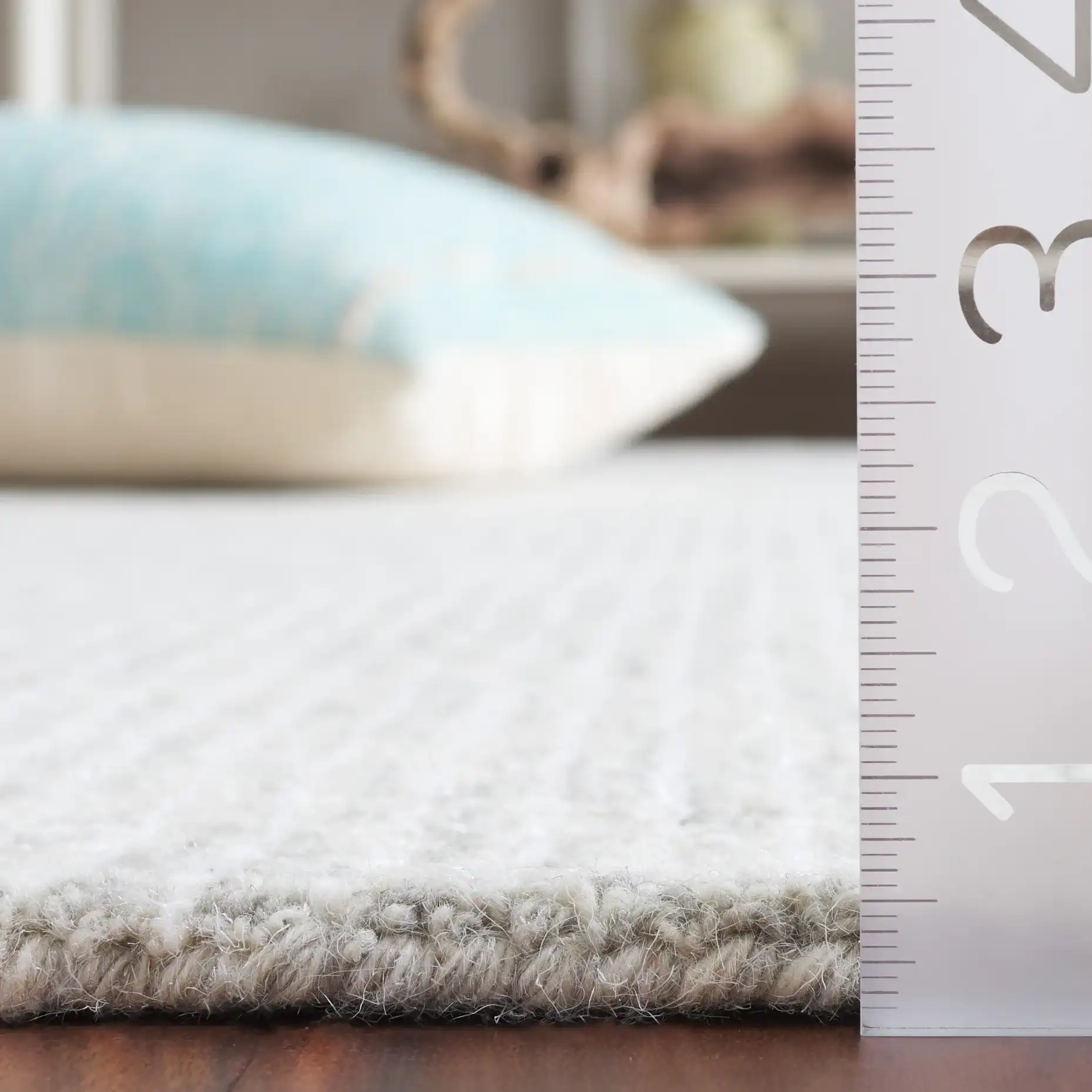 Ebony Linear Grid Hand-Tufted Rug in Gray / Ivory in a styled room