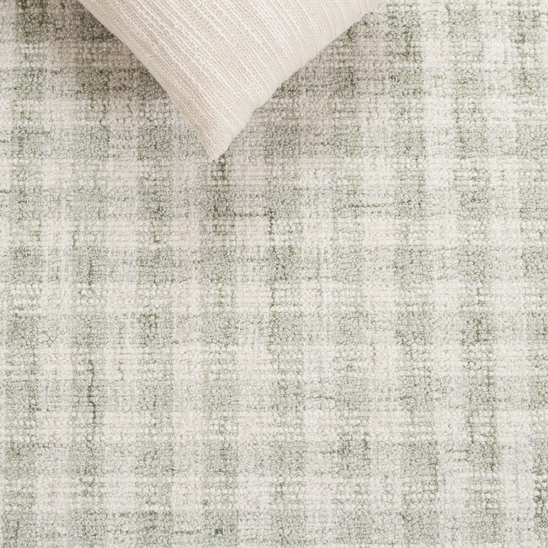 Ebony Checkered Hand-Tufted Wool Rug in Sage / Ivory in a styled room