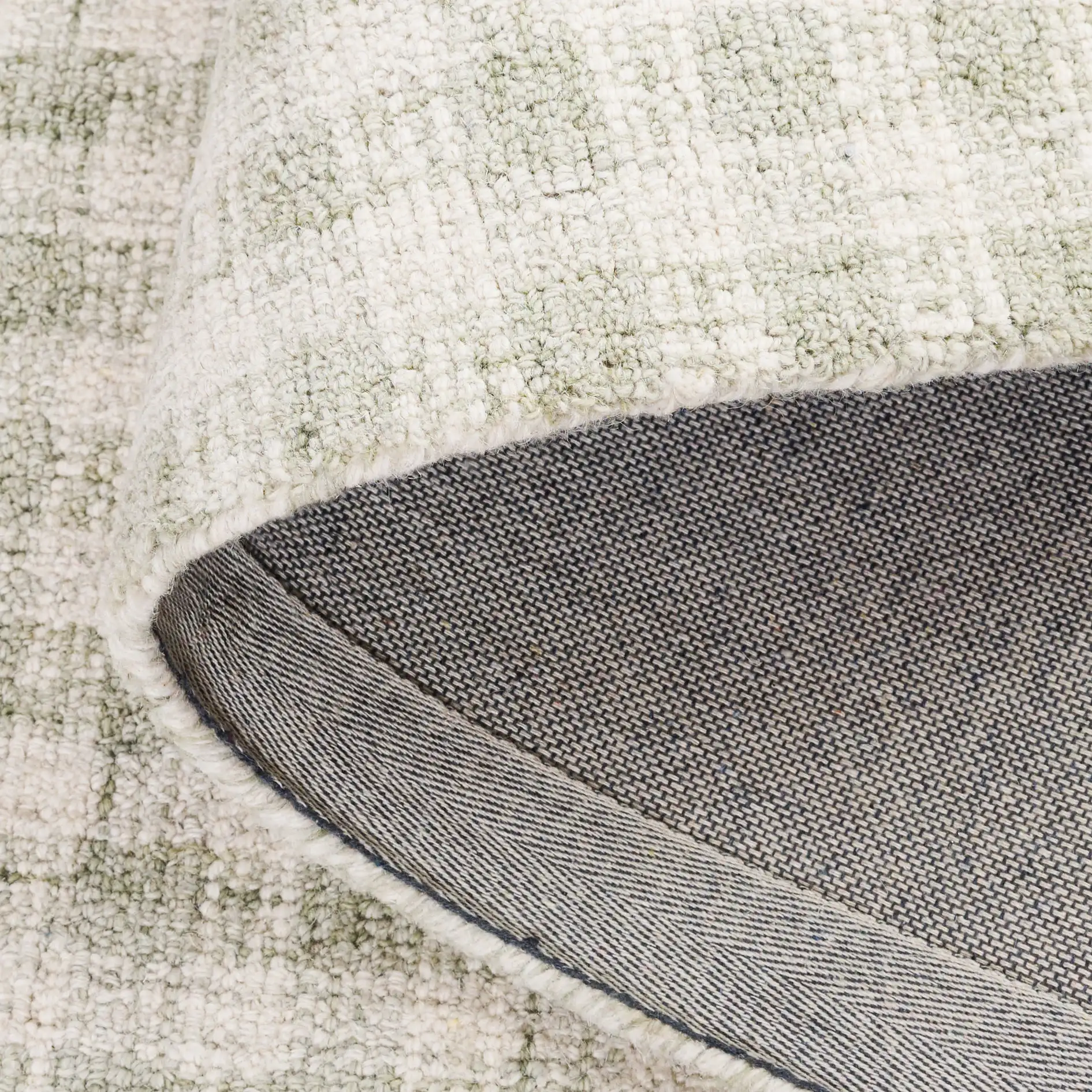 Ebony Checkered Hand-Tufted Wool Rug in Sage / Ivory in a styled room