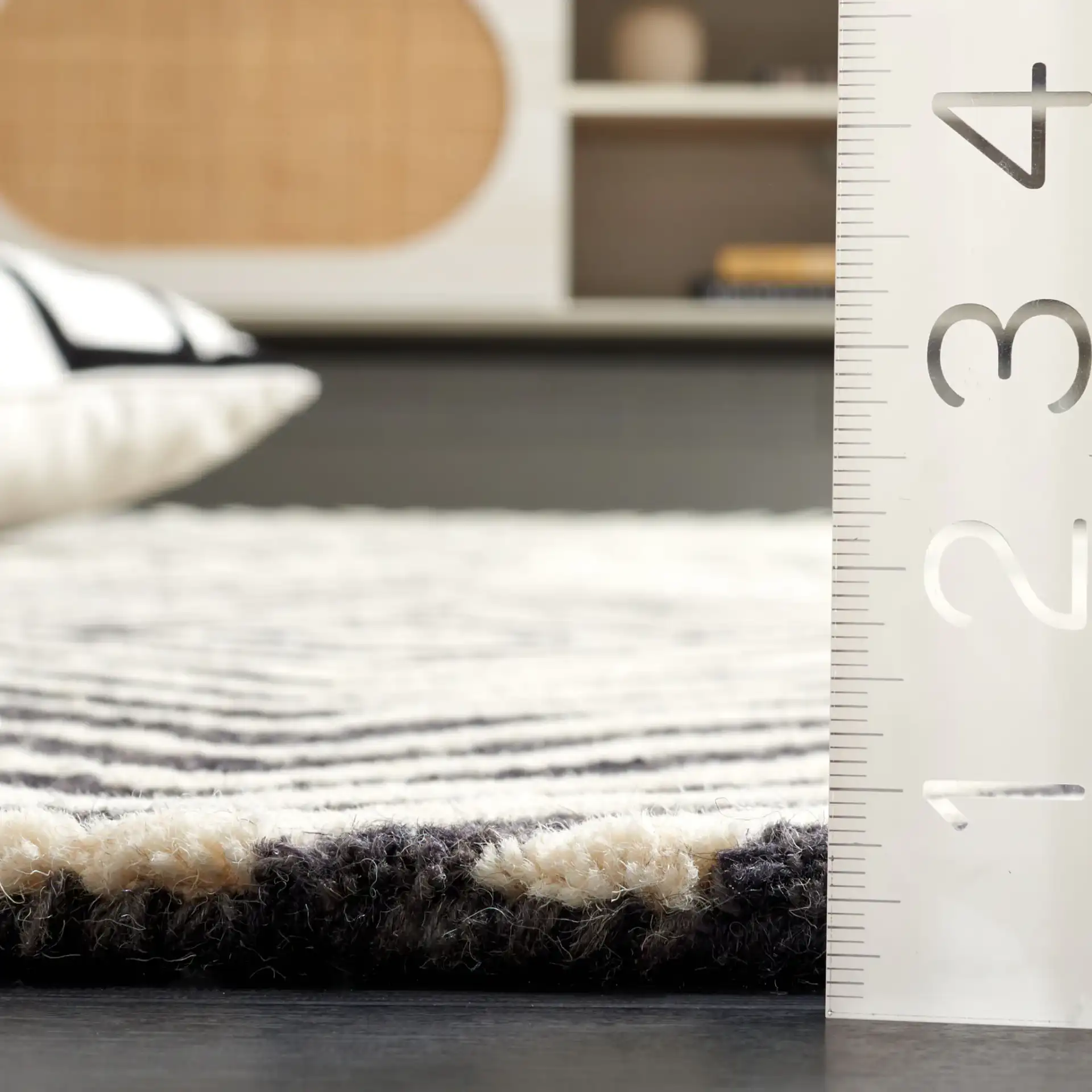 Ebony Nested Diamond Hand-Tufted Wool Rug in Black / Ivory in a styled room