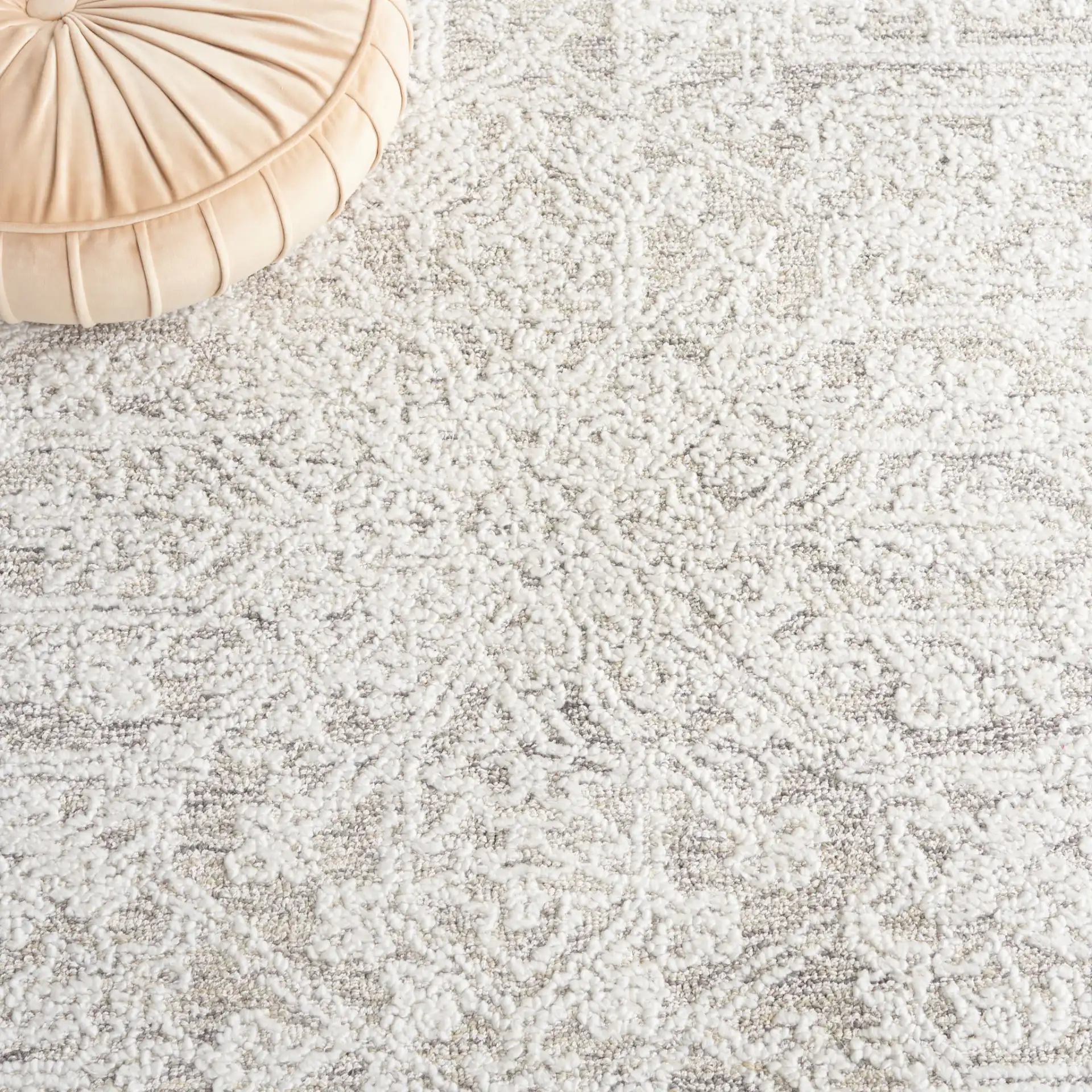 Ebony Medallion Hand-Tufted Rug in Ivory / Silver in a styled room