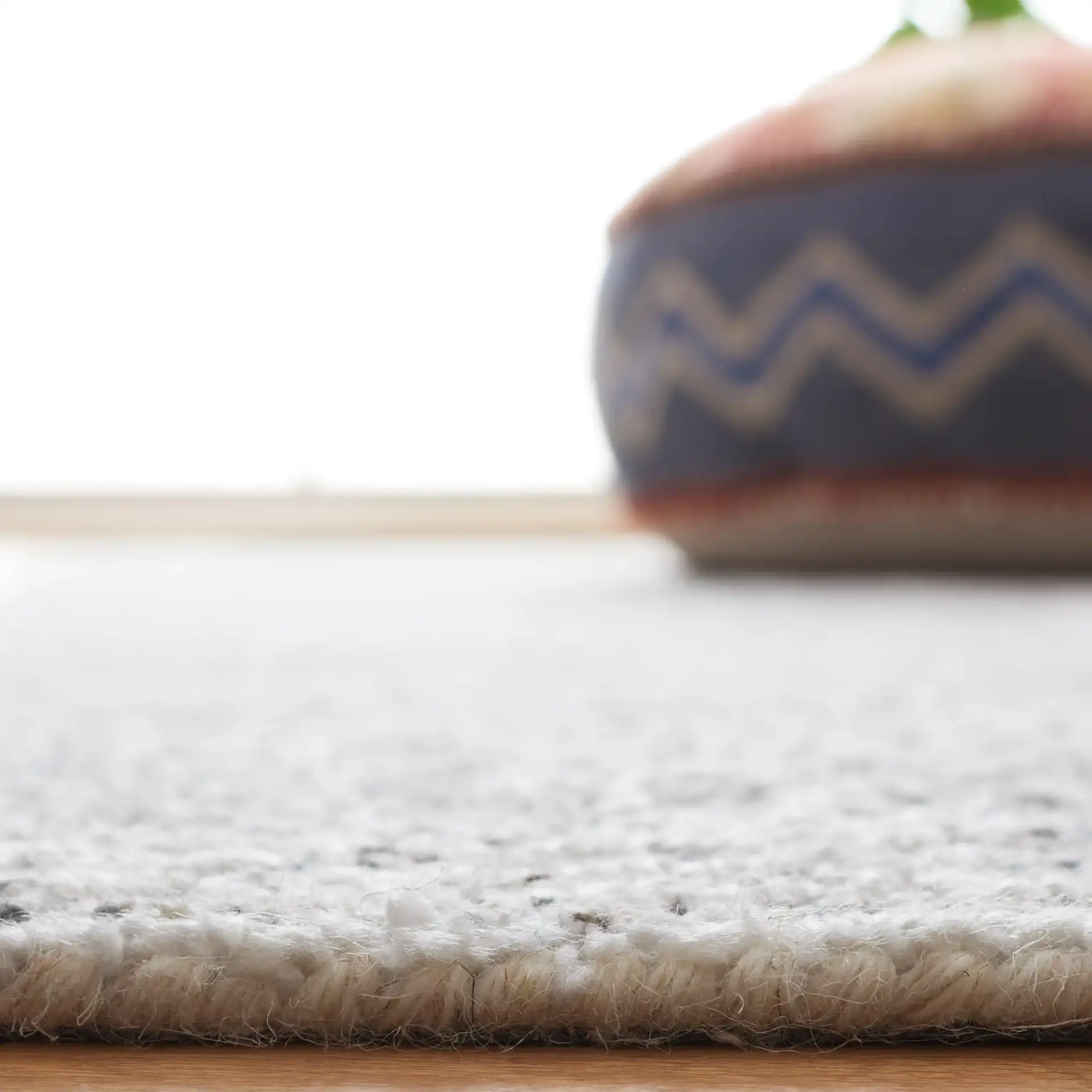 Ebony Patchwork Hand-Tufted Rug in Gray / Ivory in a styled room