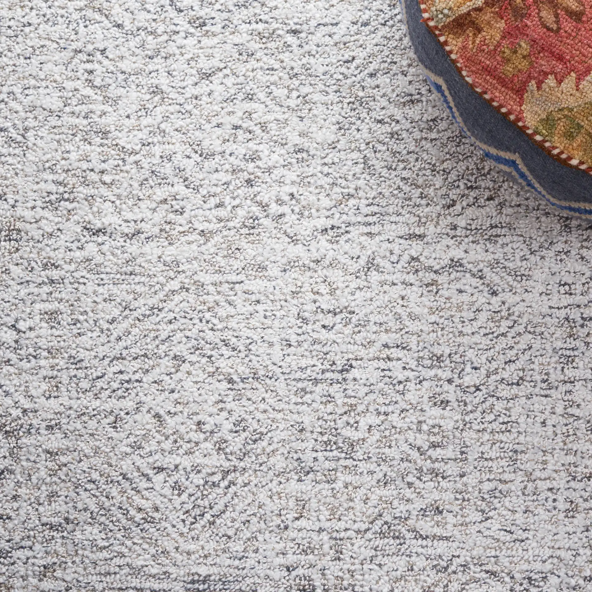 Ebony Patchwork Hand-Tufted Rug in Gray / Ivory in a styled room