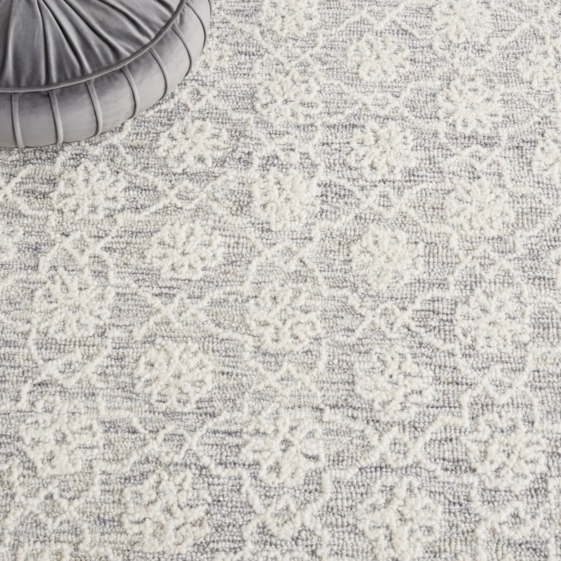 Ebony Bordered Trellis Hand-Tufted Wool Rug in Gray / Ivory in a styled room