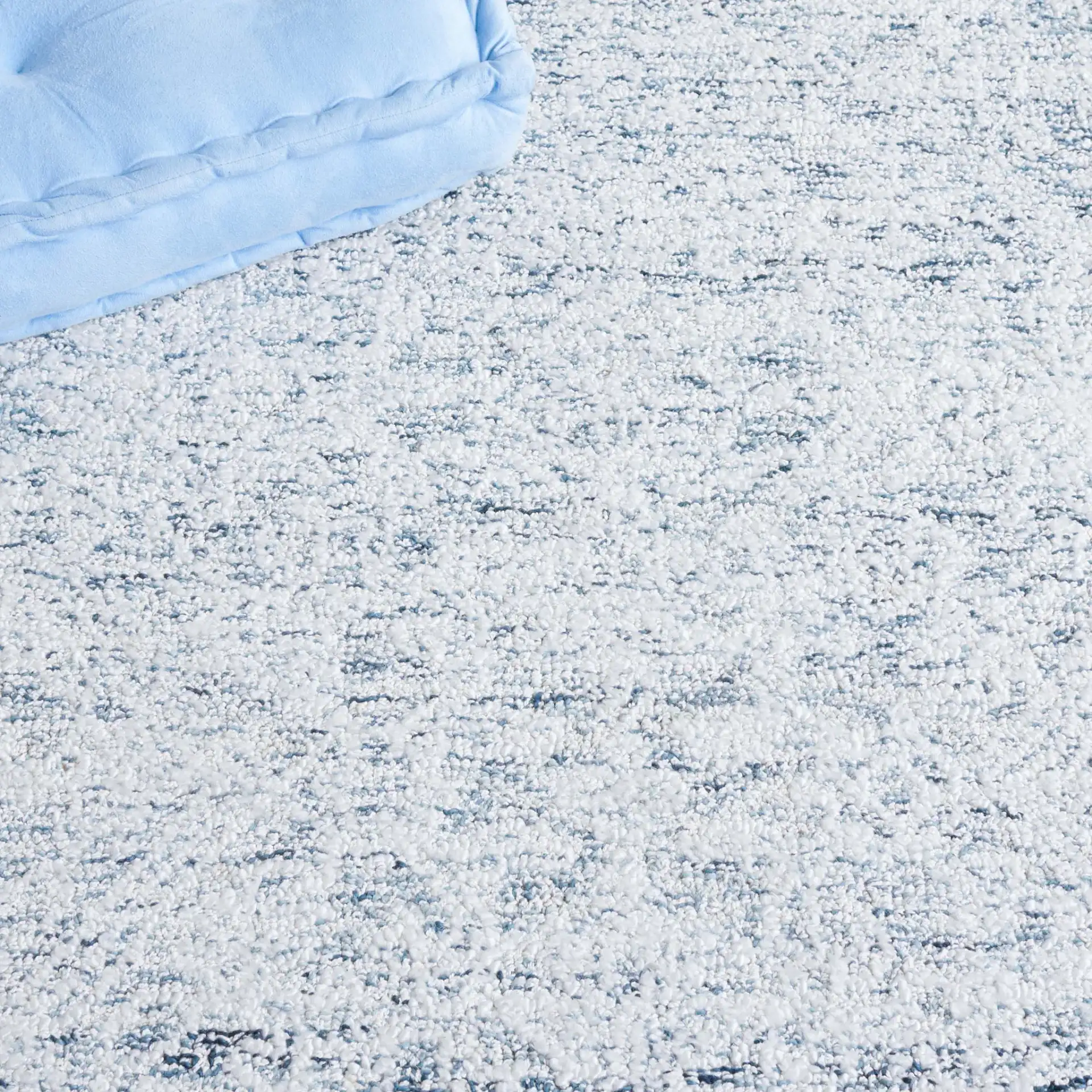 Ebony Erased Damask Hand-Tufted Rug in Light Blue / Ivory in a styled room