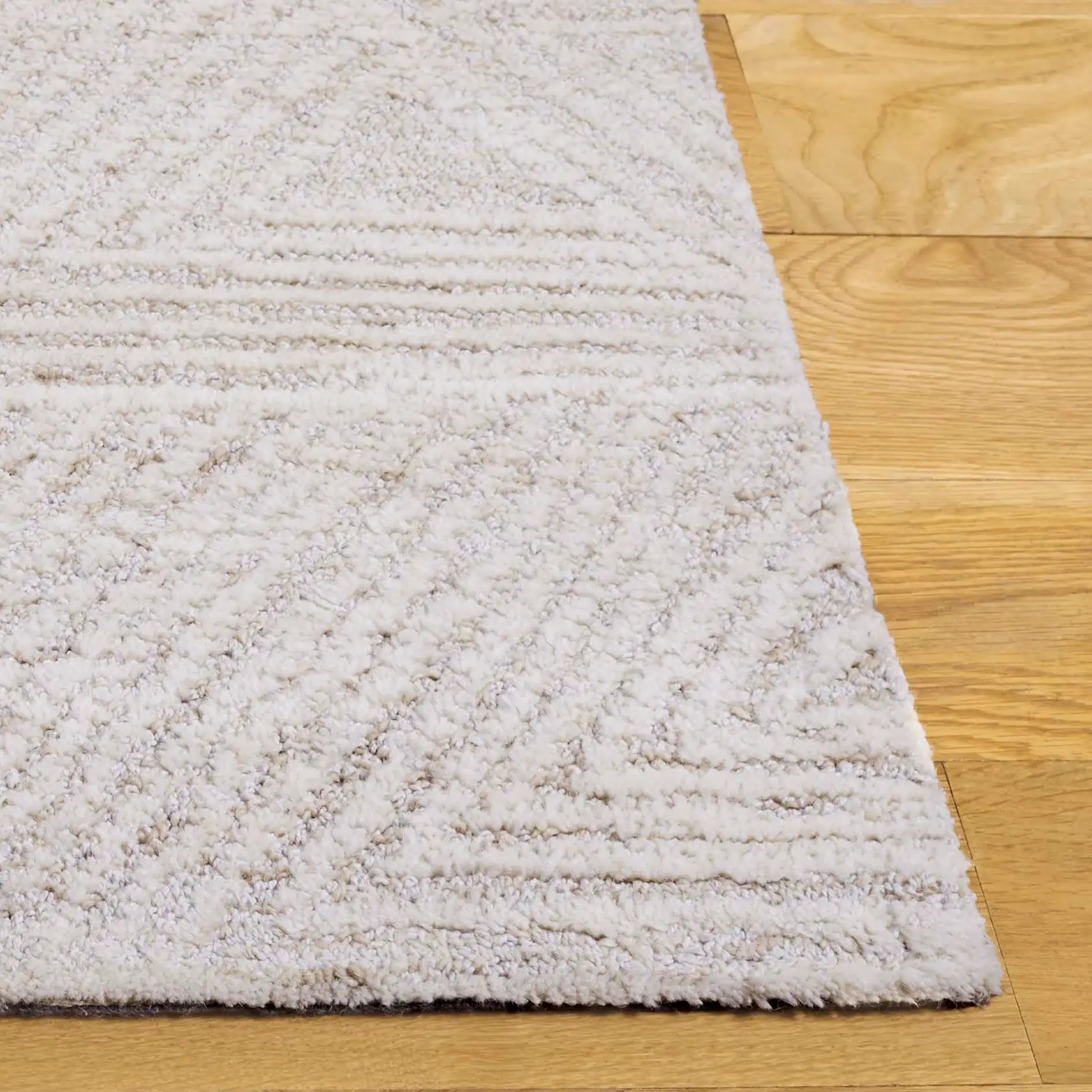 Ebony Triangle Grid Hand-Tufted Wool Rug in Ivory / Beige in a styled room