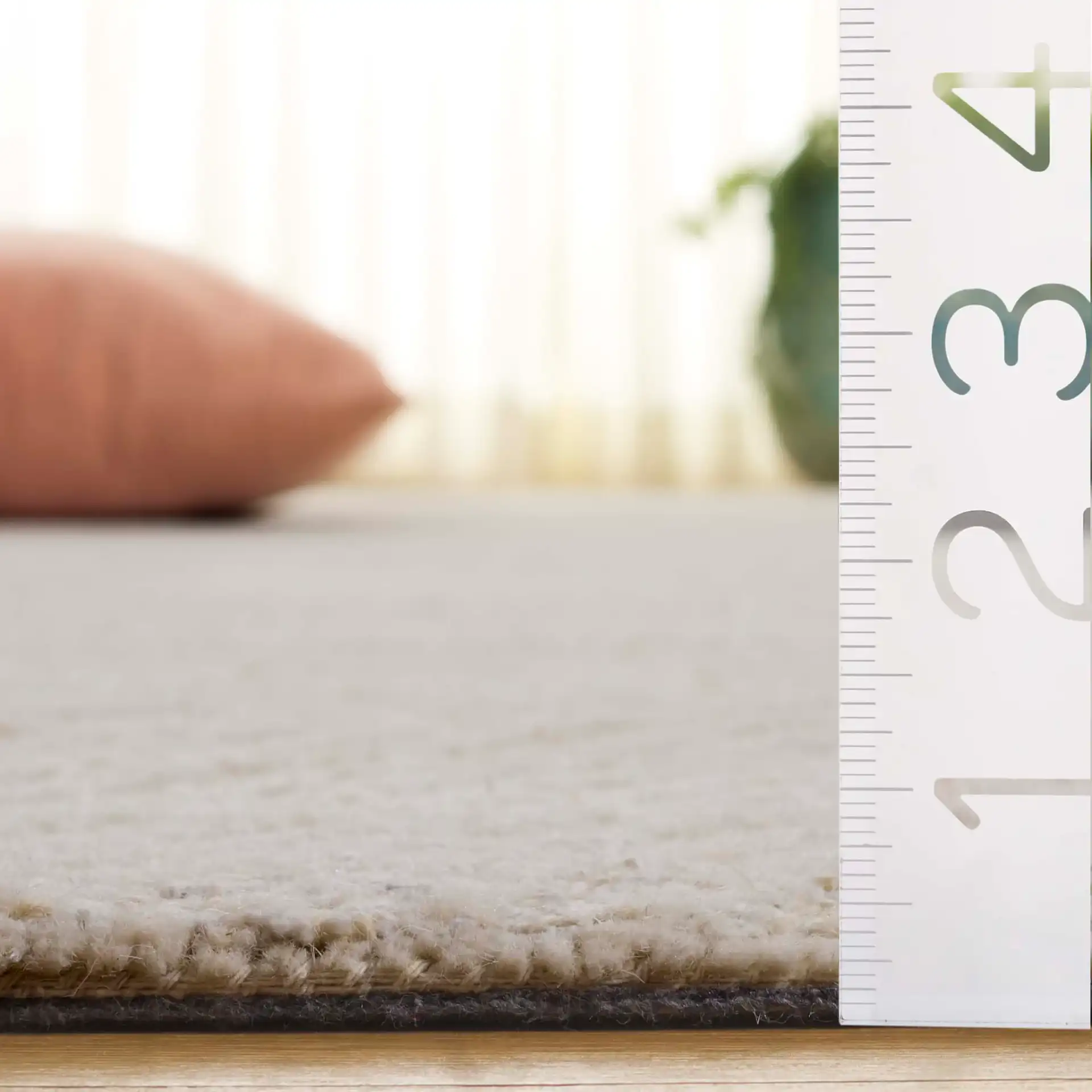 Ebony Triangle Grid Hand-Tufted Wool Rug in Ivory / Beige in a styled room