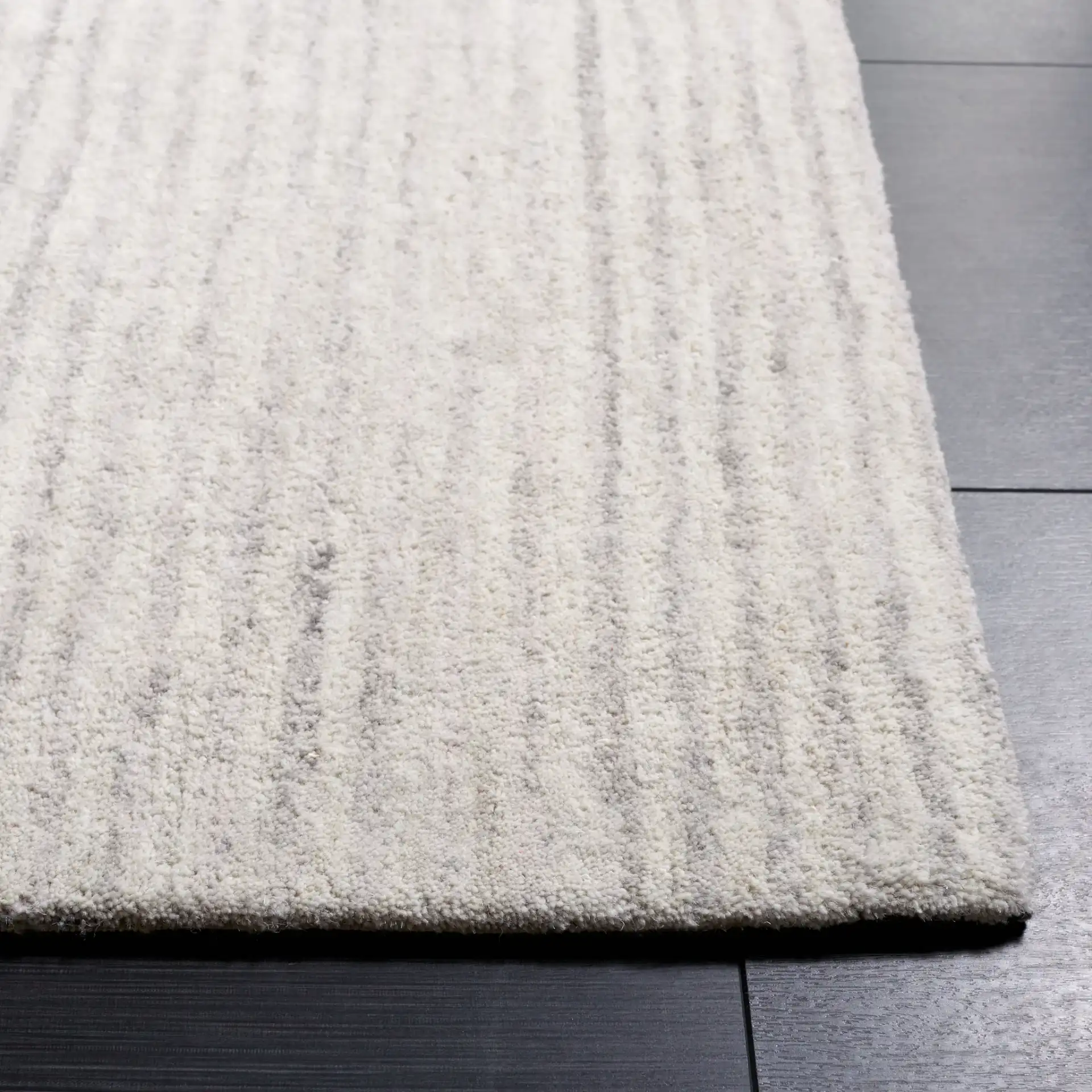 Ebony Linear Block Hand-Tufted Rug in Beige / Gray in a styled room